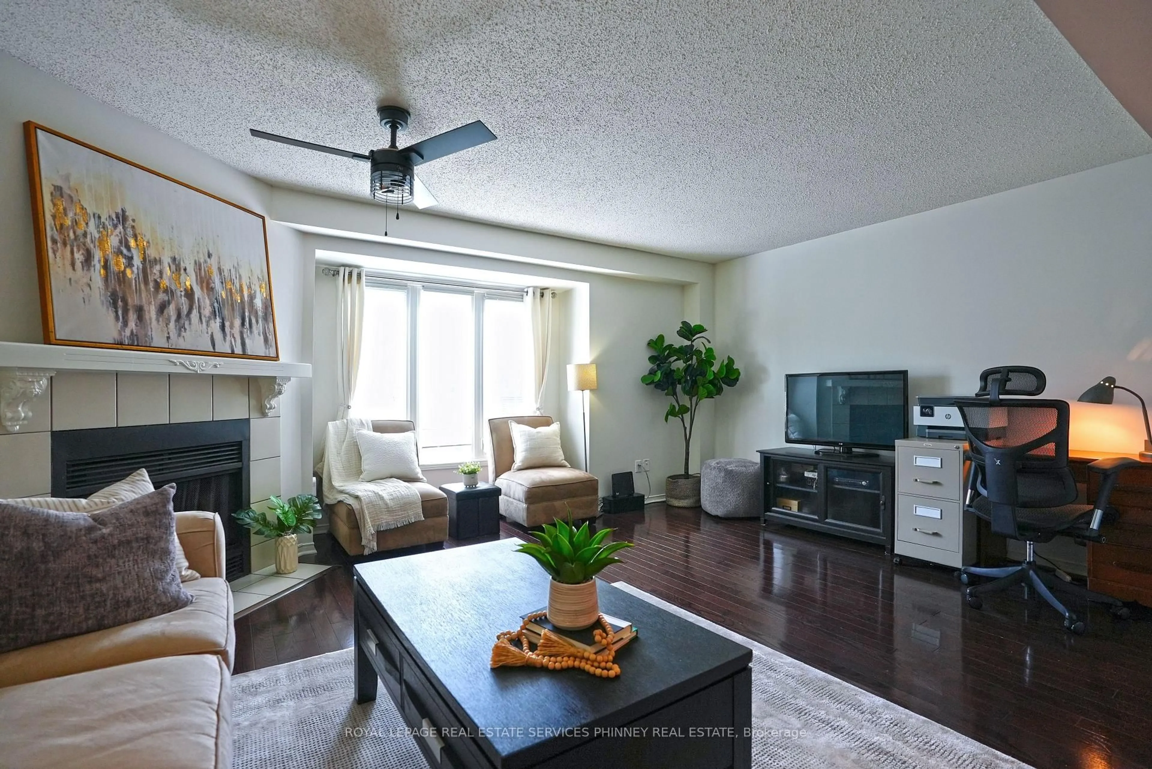 Living room with furniture, wood/laminate floor for 3140 Fifth Line #28, Mississauga Ontario L5L 1A2