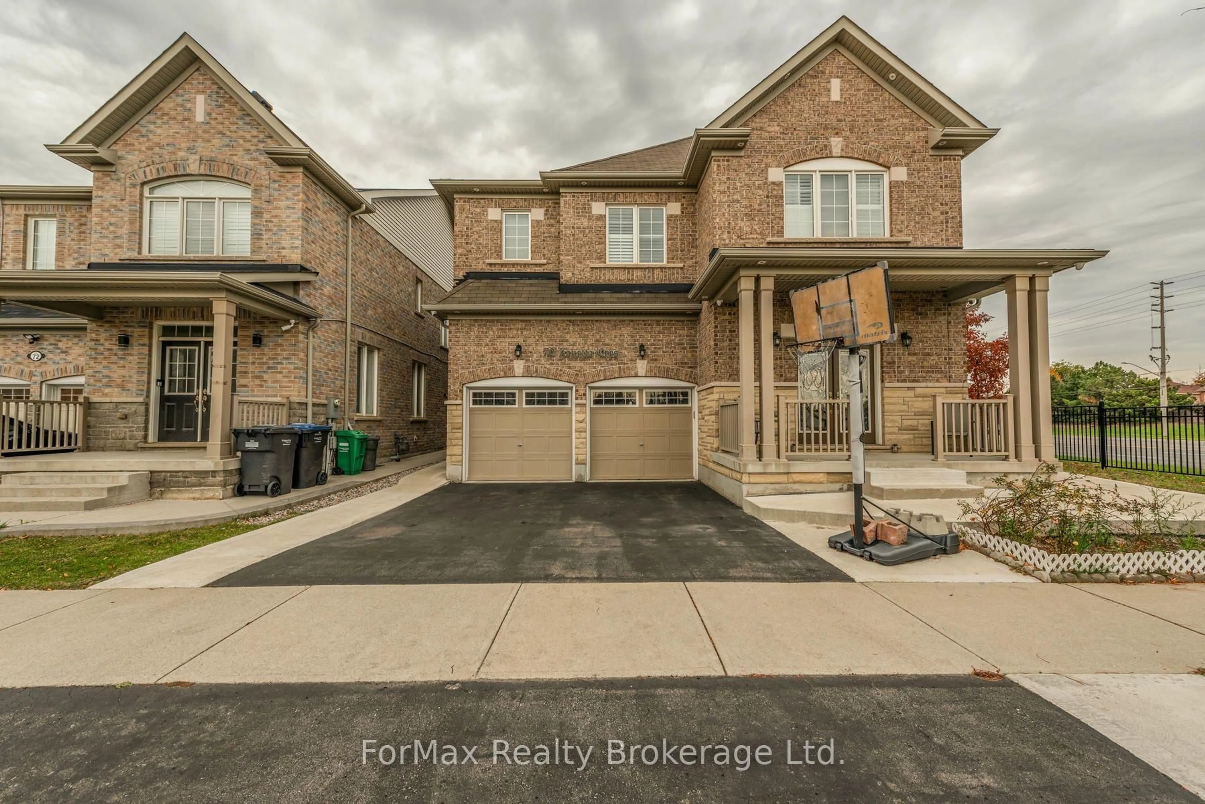 Home with brick exterior material, street for 70 Zanetta Cres, Brampton Ontario L6Y 6A2