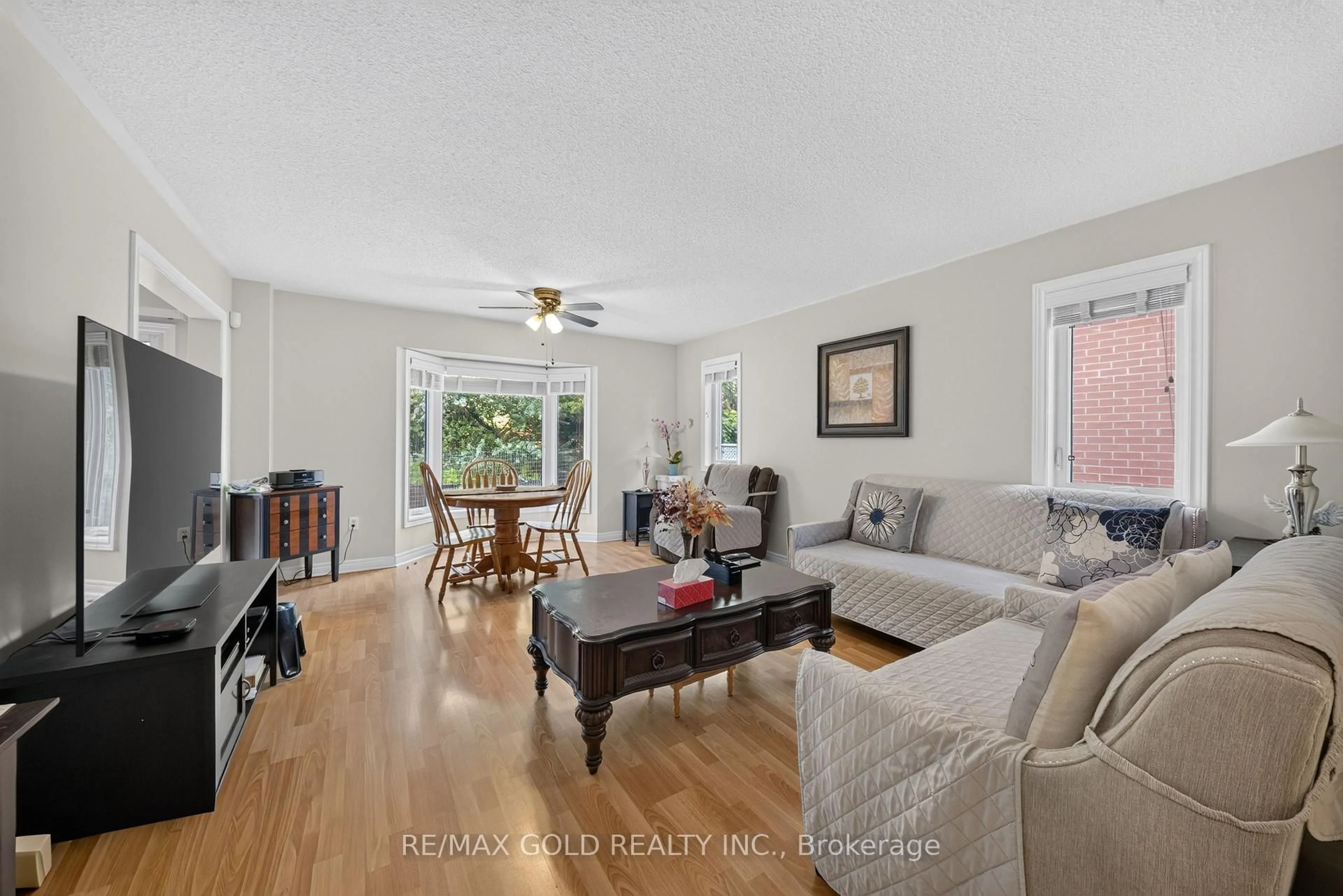 Living room with furniture, unknown for 142 Pressed Brick Dr, Brampton Ontario L6V 4K6