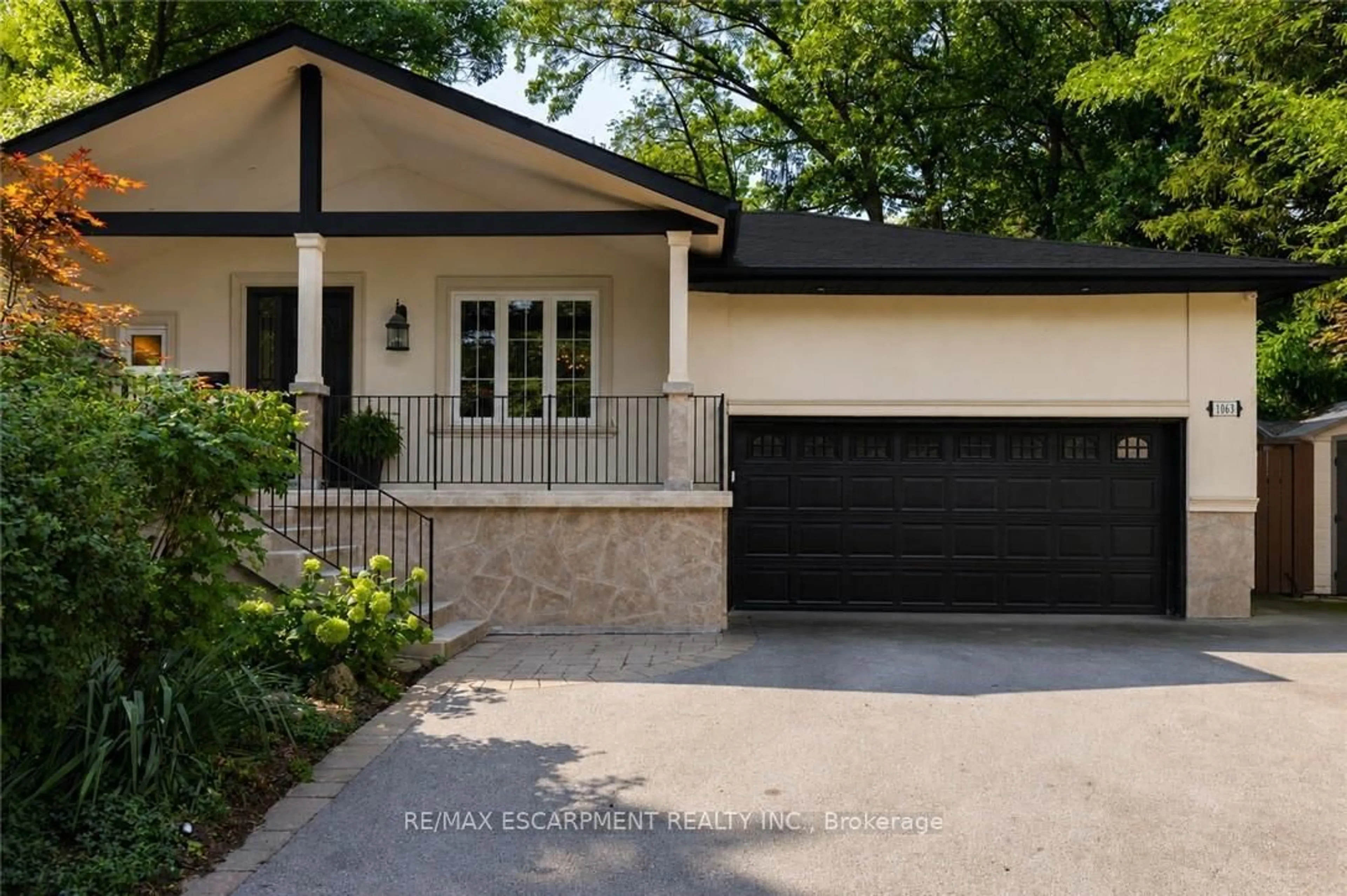 Home with brick exterior material, street for 1063 Greenoaks Dr, Mississauga Ontario L5J 3A1