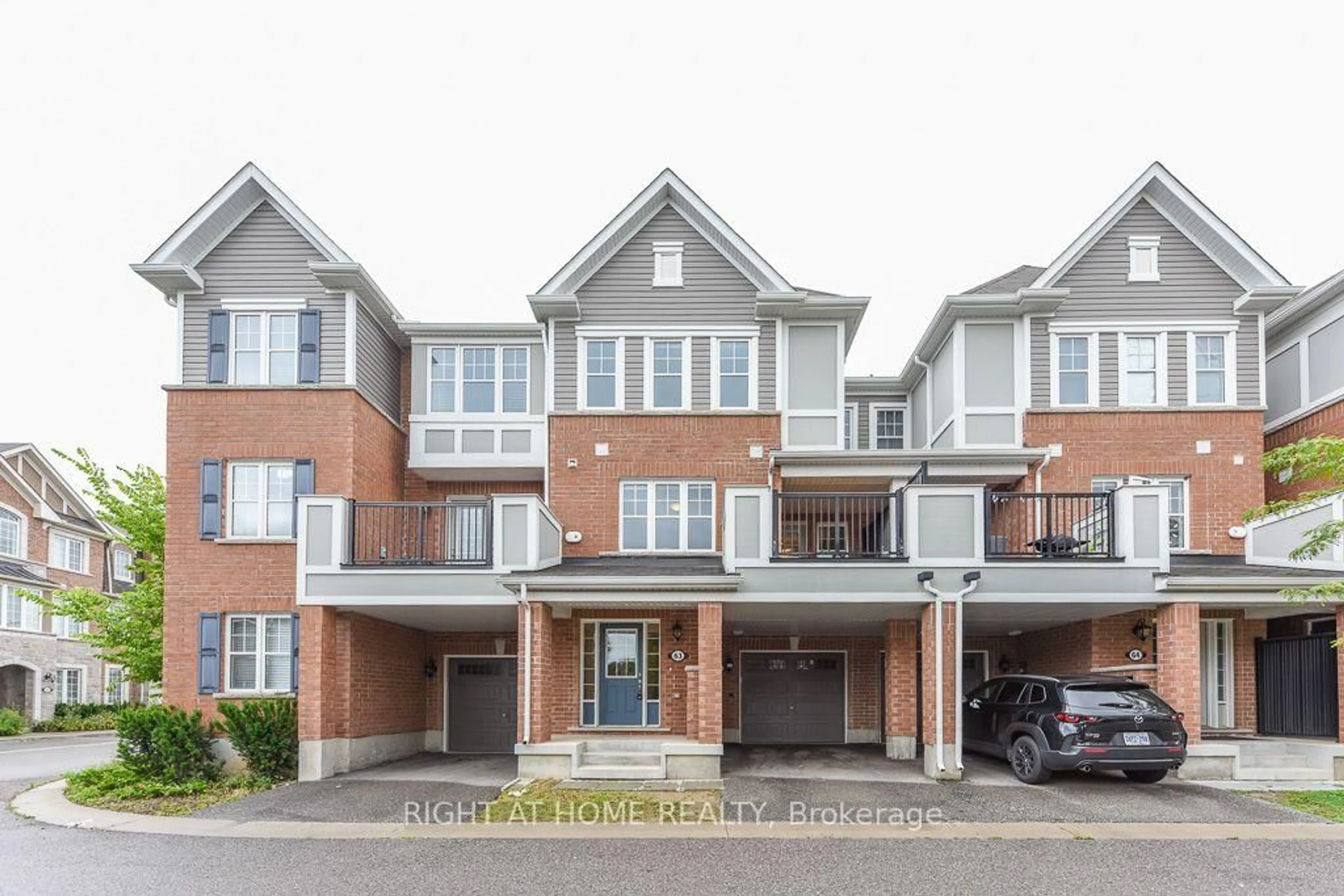Home with brick exterior material, street for 1222 Rose Way #63, Milton Ontario L9E 1P2