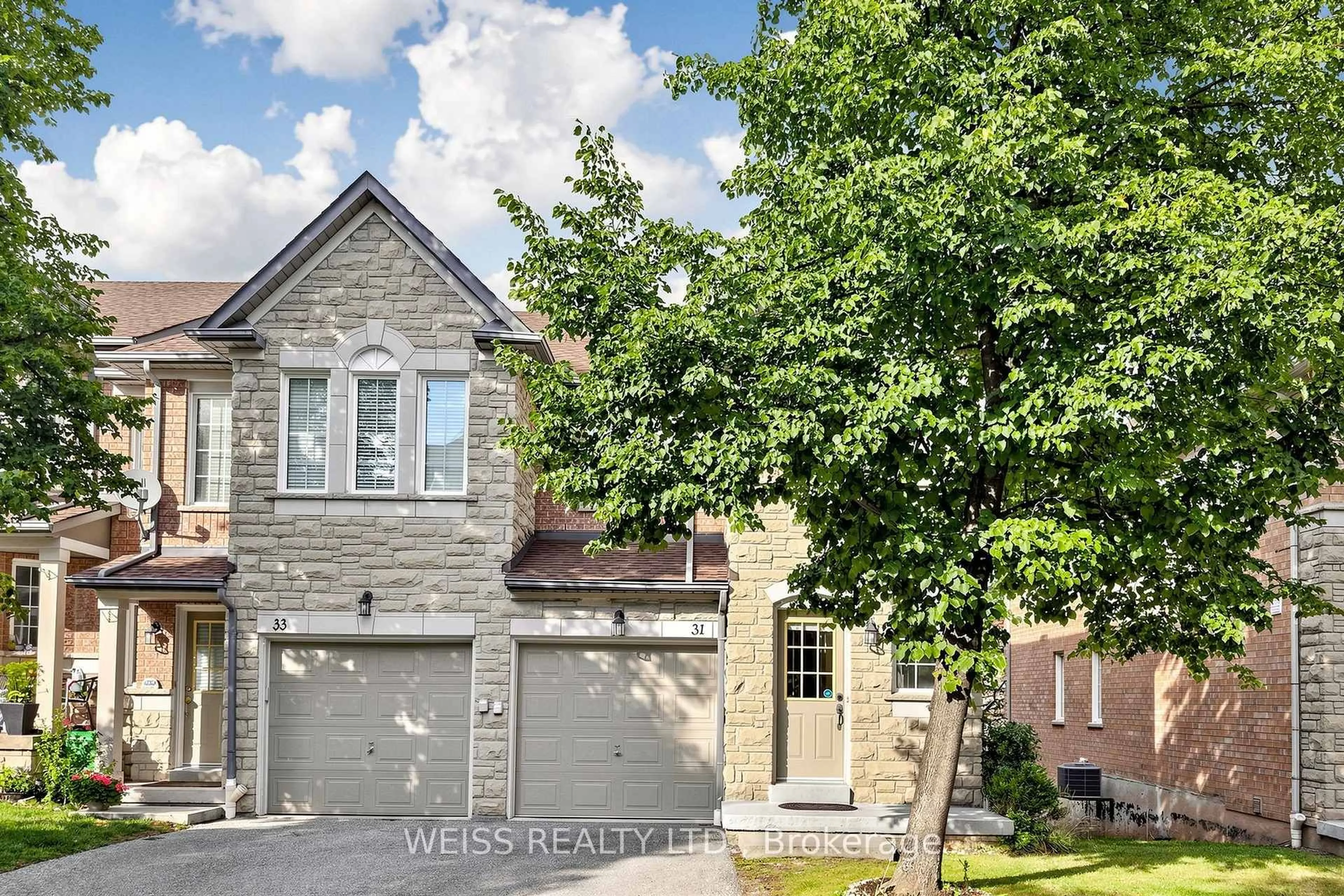 Home with brick exterior material, street for 5260 McFarren Blvd #31, Mississauga Ontario L5M 7J1