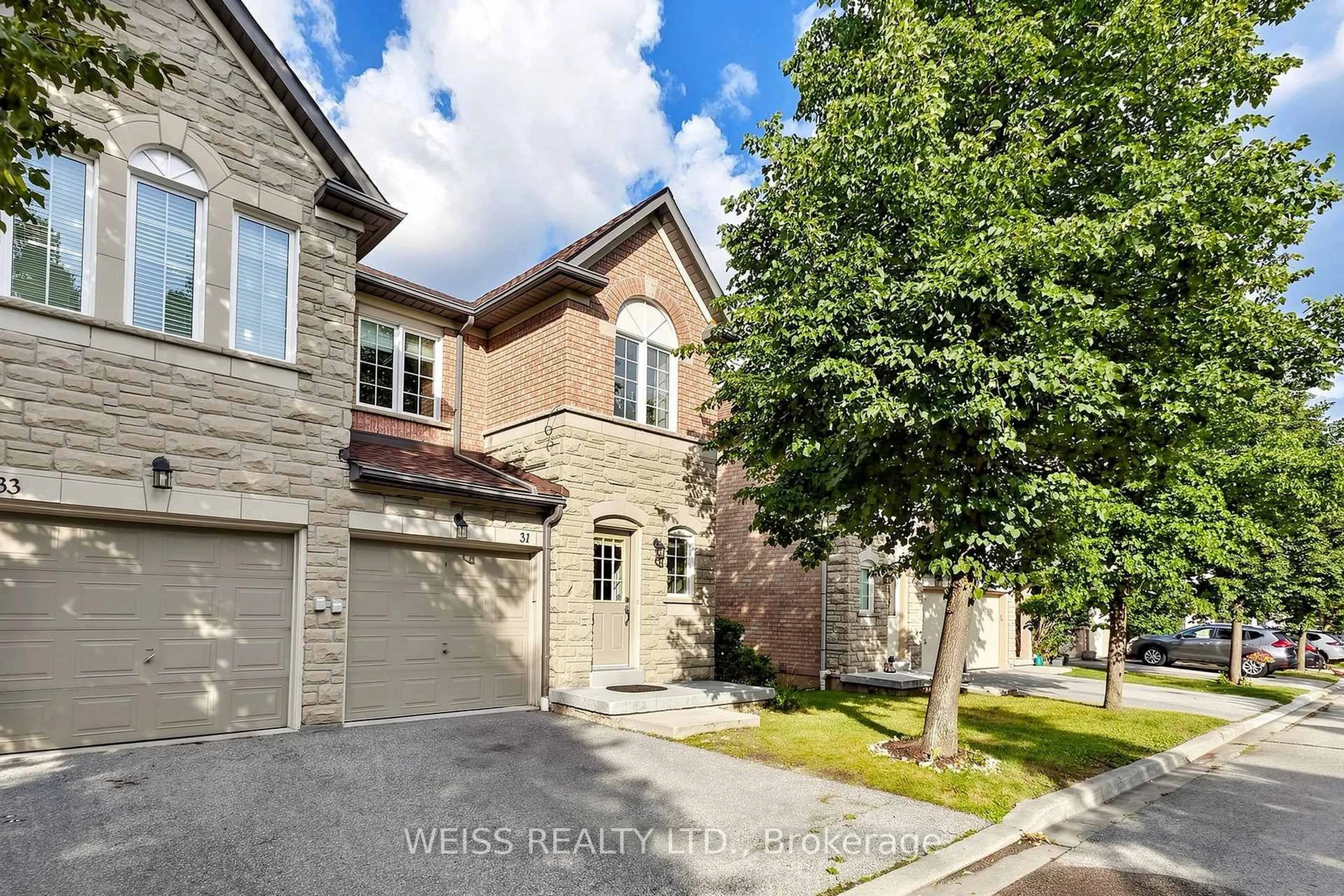 Home with brick exterior material, street for 5260 McFarren Blvd #31, Mississauga Ontario L5M 7J1