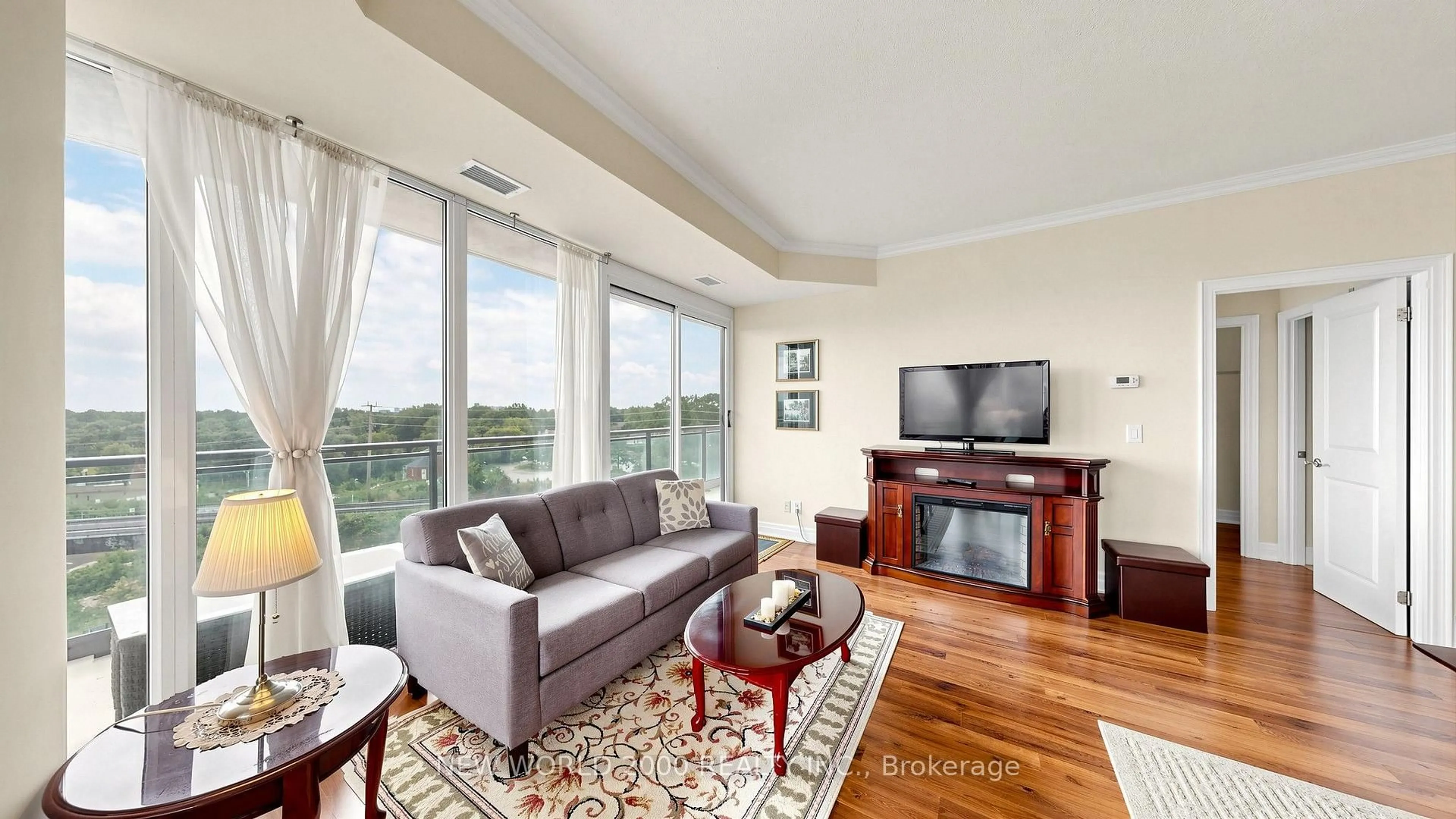 Living room with furniture, wood/laminate floor for 100 John St #502, Brampton Ontario L6W 0A8