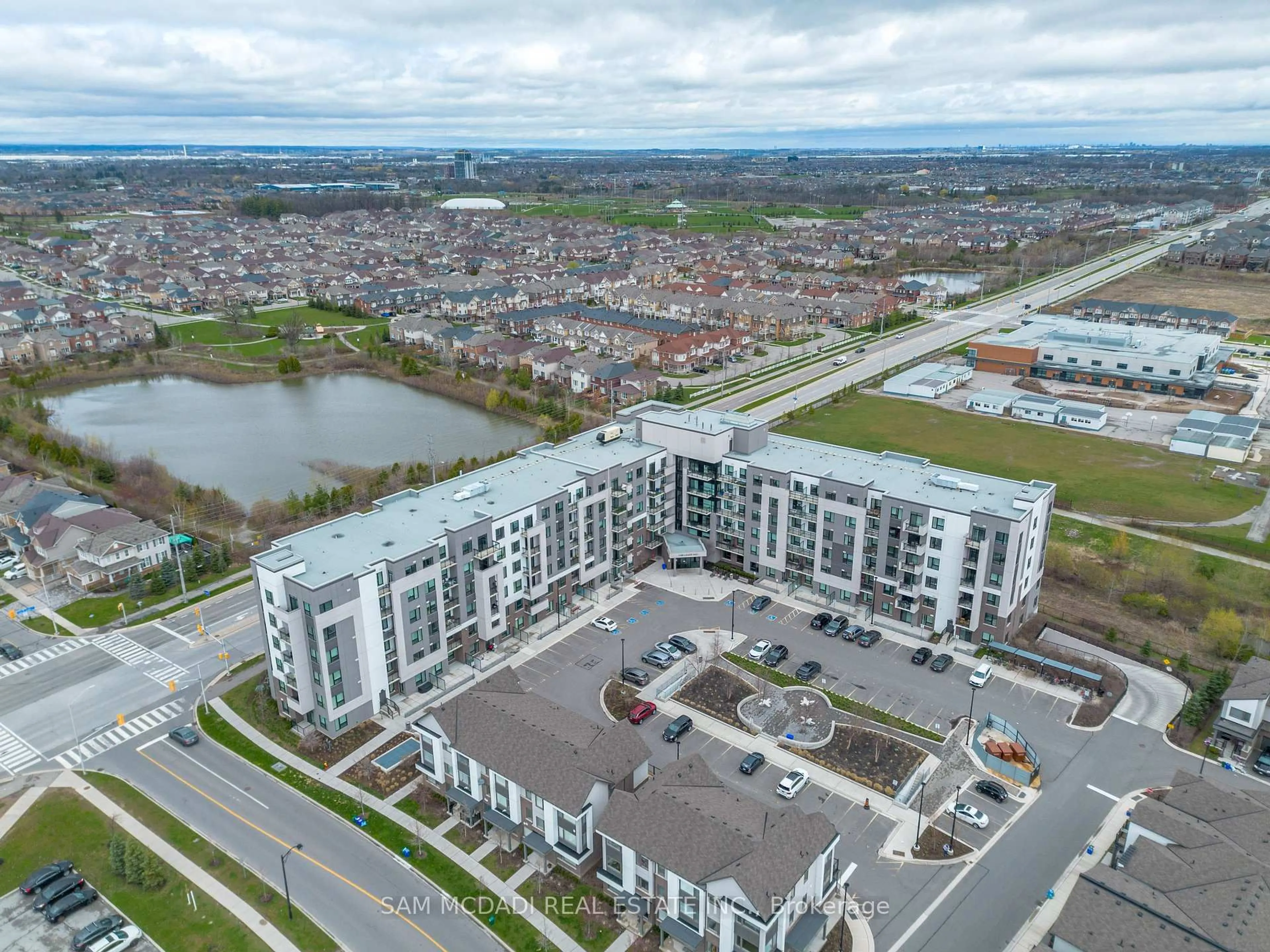 A pic from outside/outdoor area/front of a property/back of a property/a pic from drone, unknown for 1105 Leger Way #319, Milton Ontario L9E 1K7