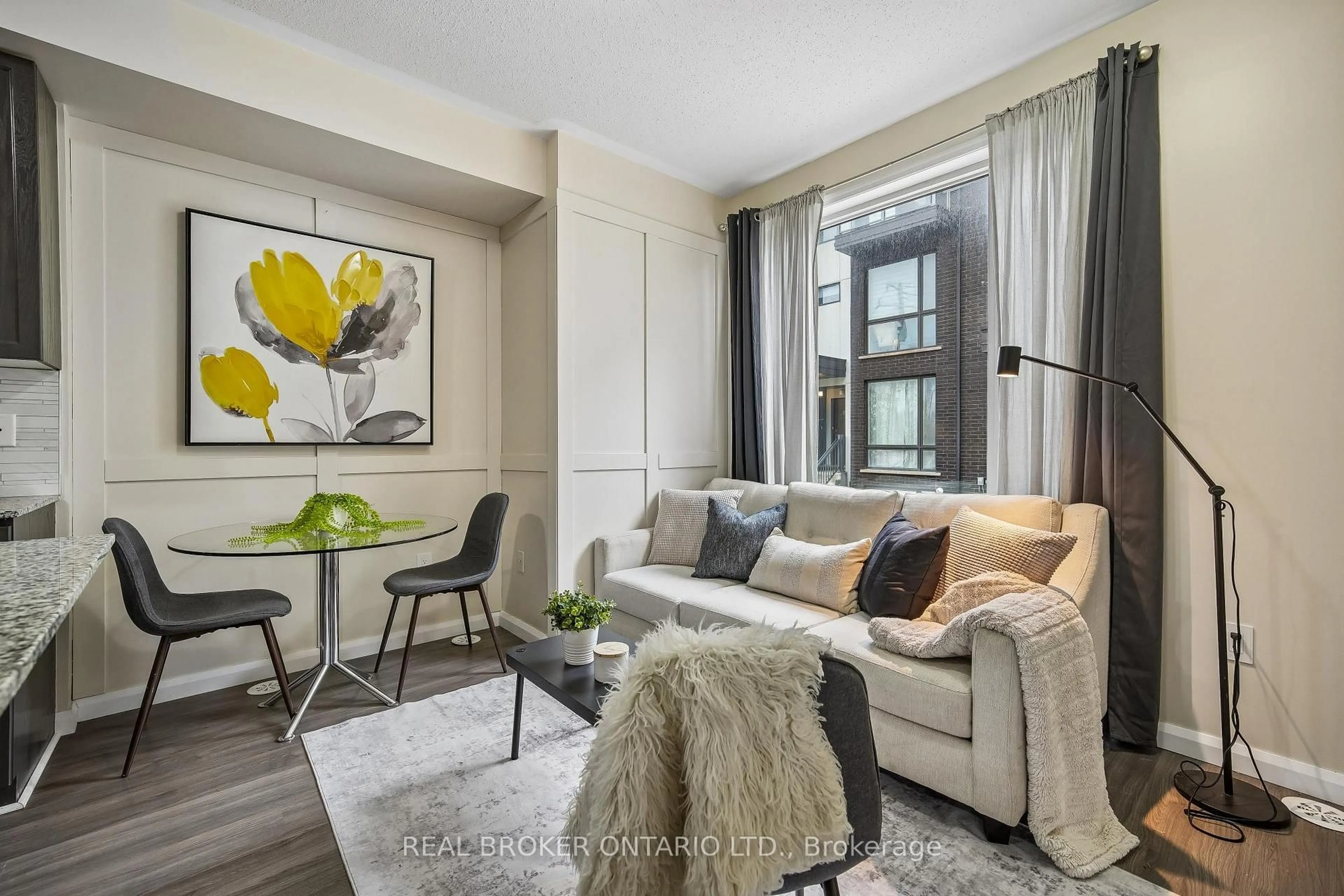 Living room with furniture, wood/laminate floor for 26 Fieldway Rd #46, Toronto Ontario M8Z 3L2