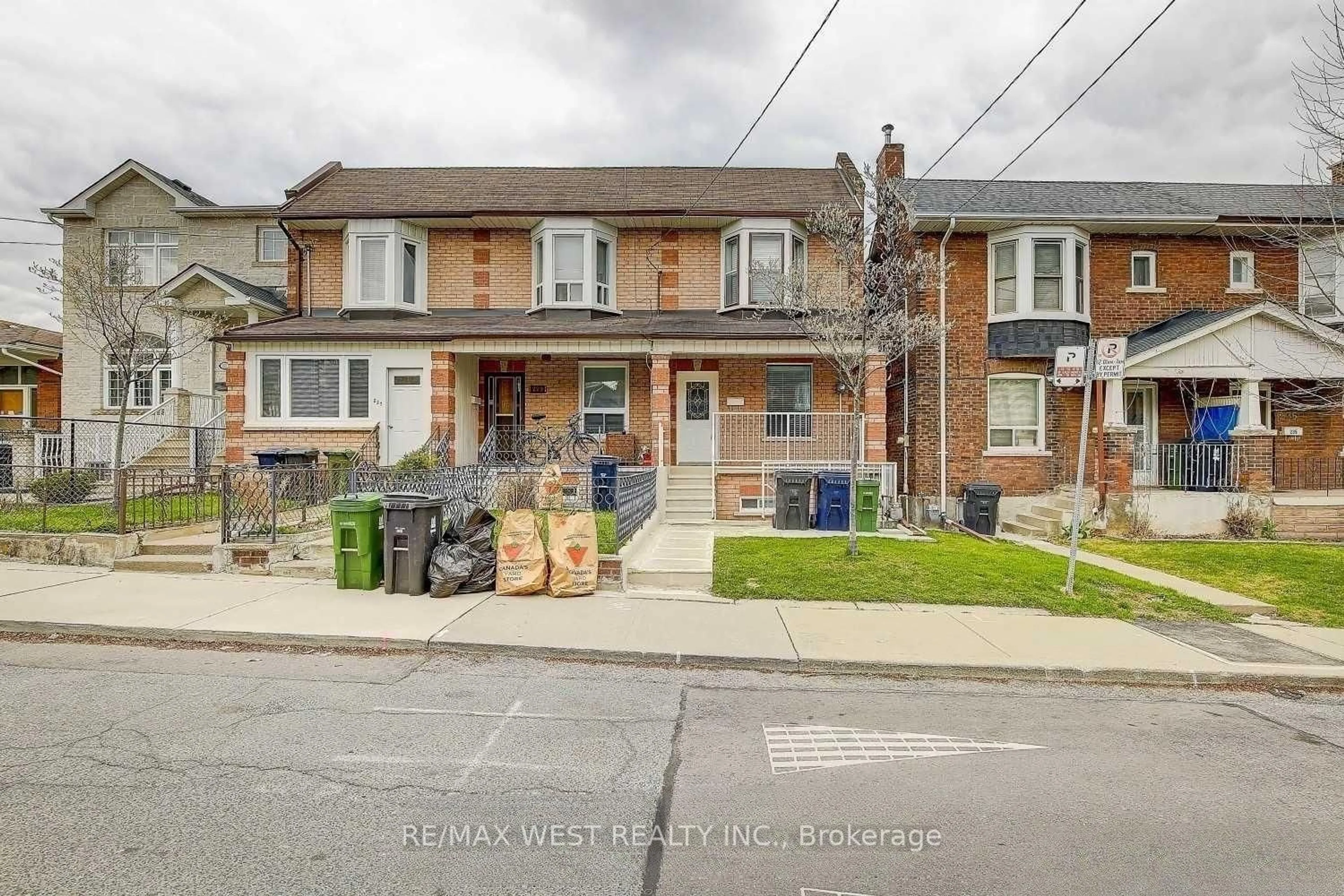 Home with brick exterior material, street for 231 Rosemount Ave, Toronto Ontario M6H 2N2