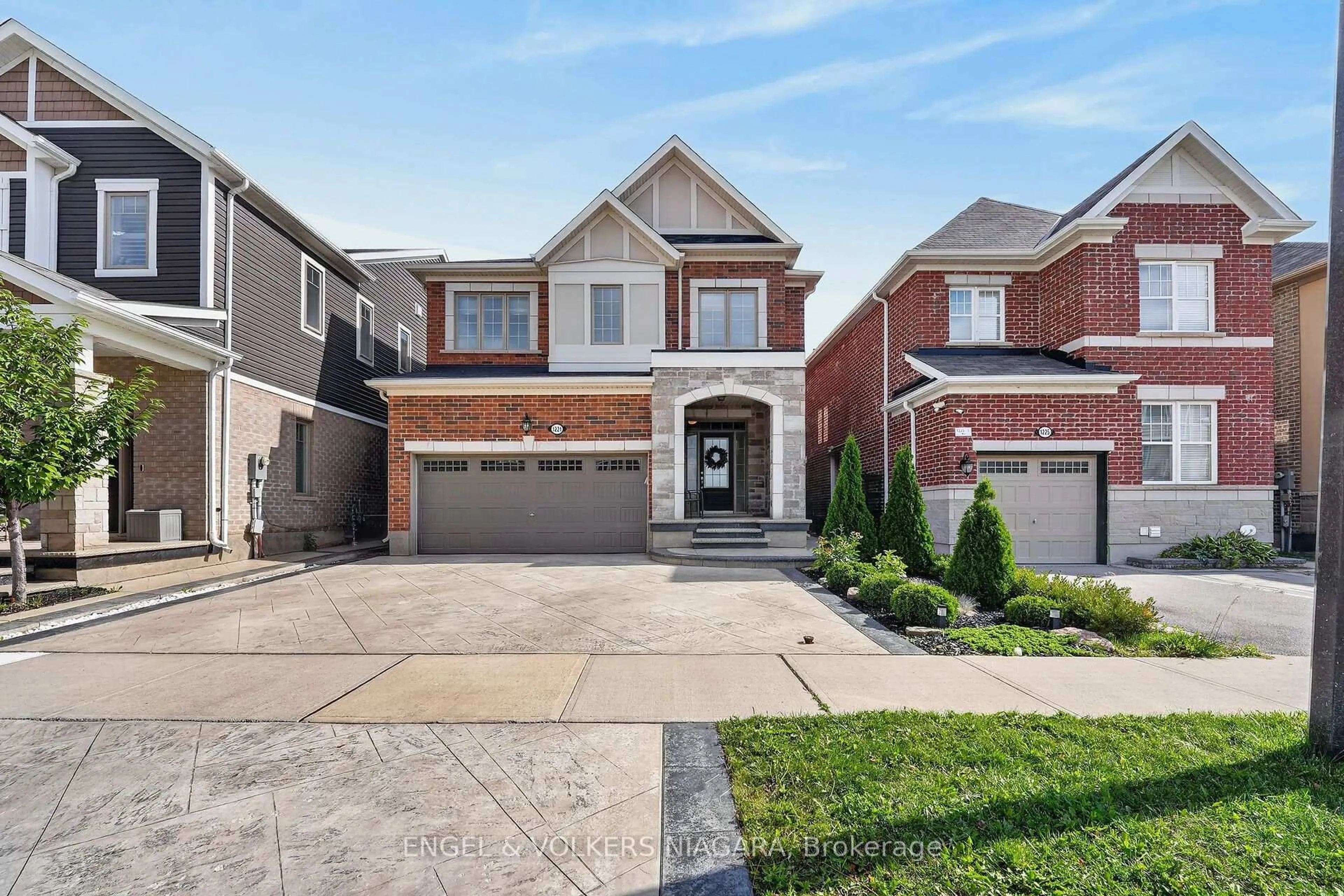 Home with brick exterior material, street for 1221 Rose Way, Milton Ontario L9E 1L9
