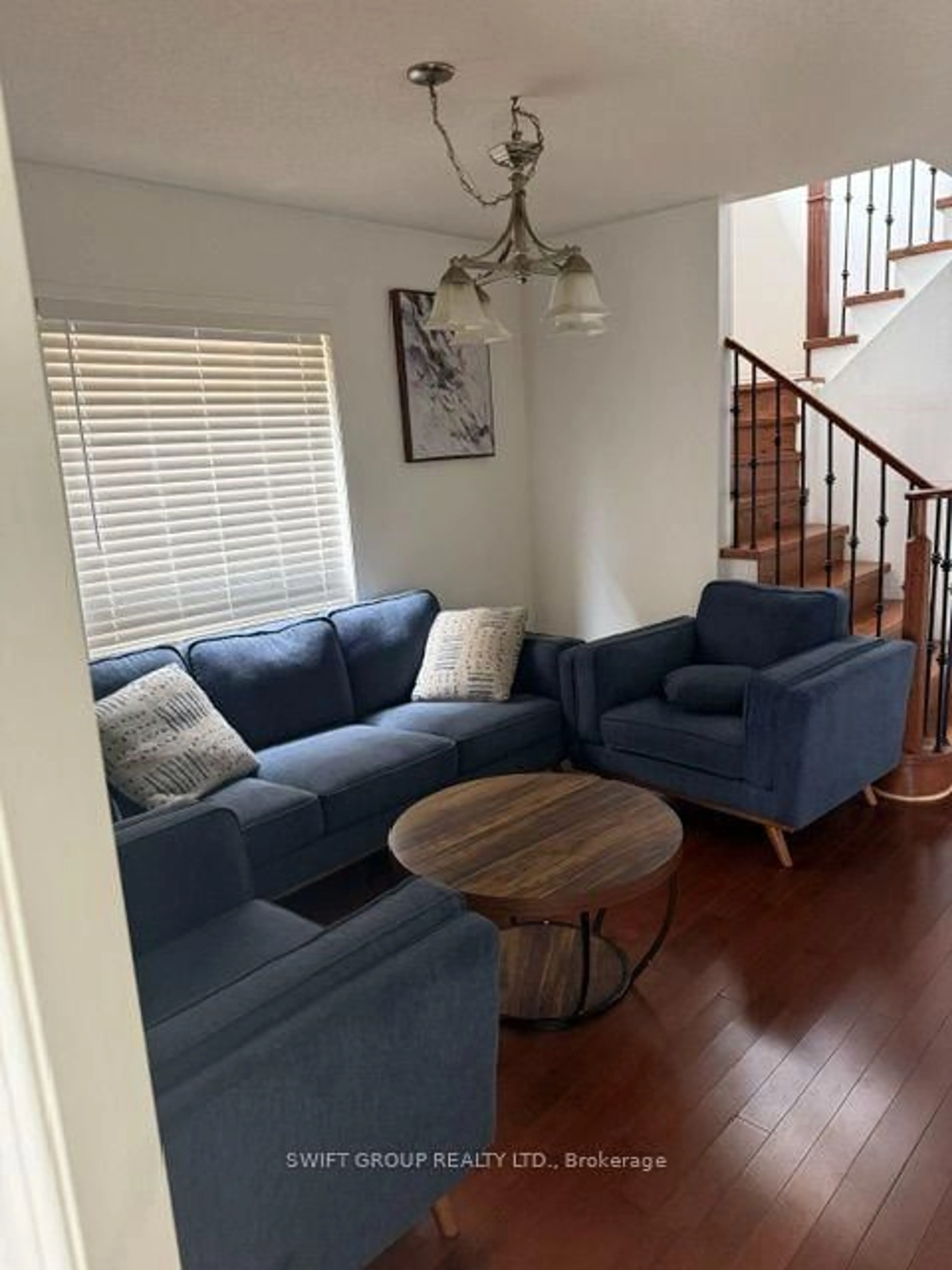 Living room with furniture, wood/laminate floor for 52 Florette Pl, Brampton Ontario L7A 3G6