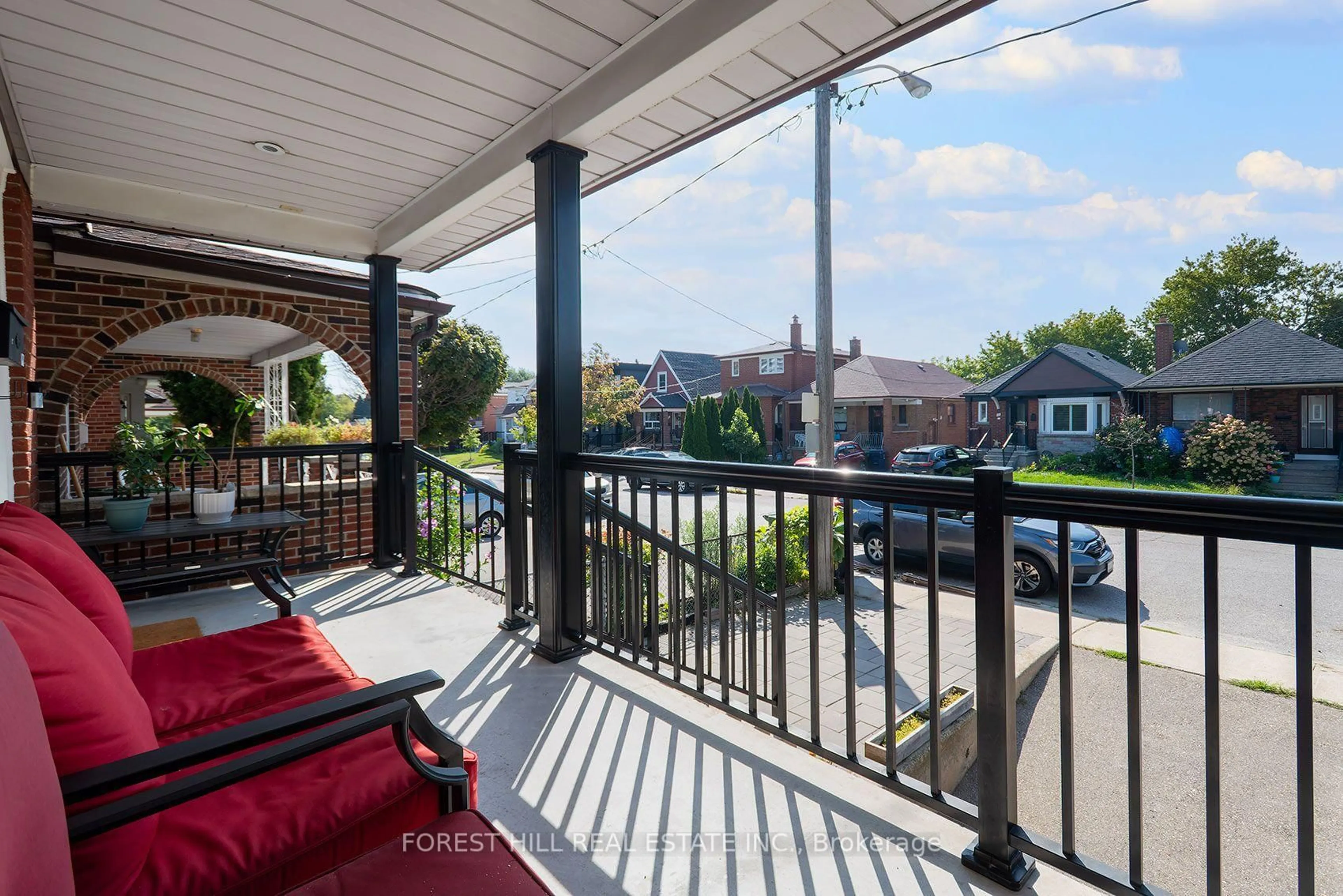 Patio, city buildings view from balcony for 94 Belgravia Ave, Toronto Ontario M6E 2M5