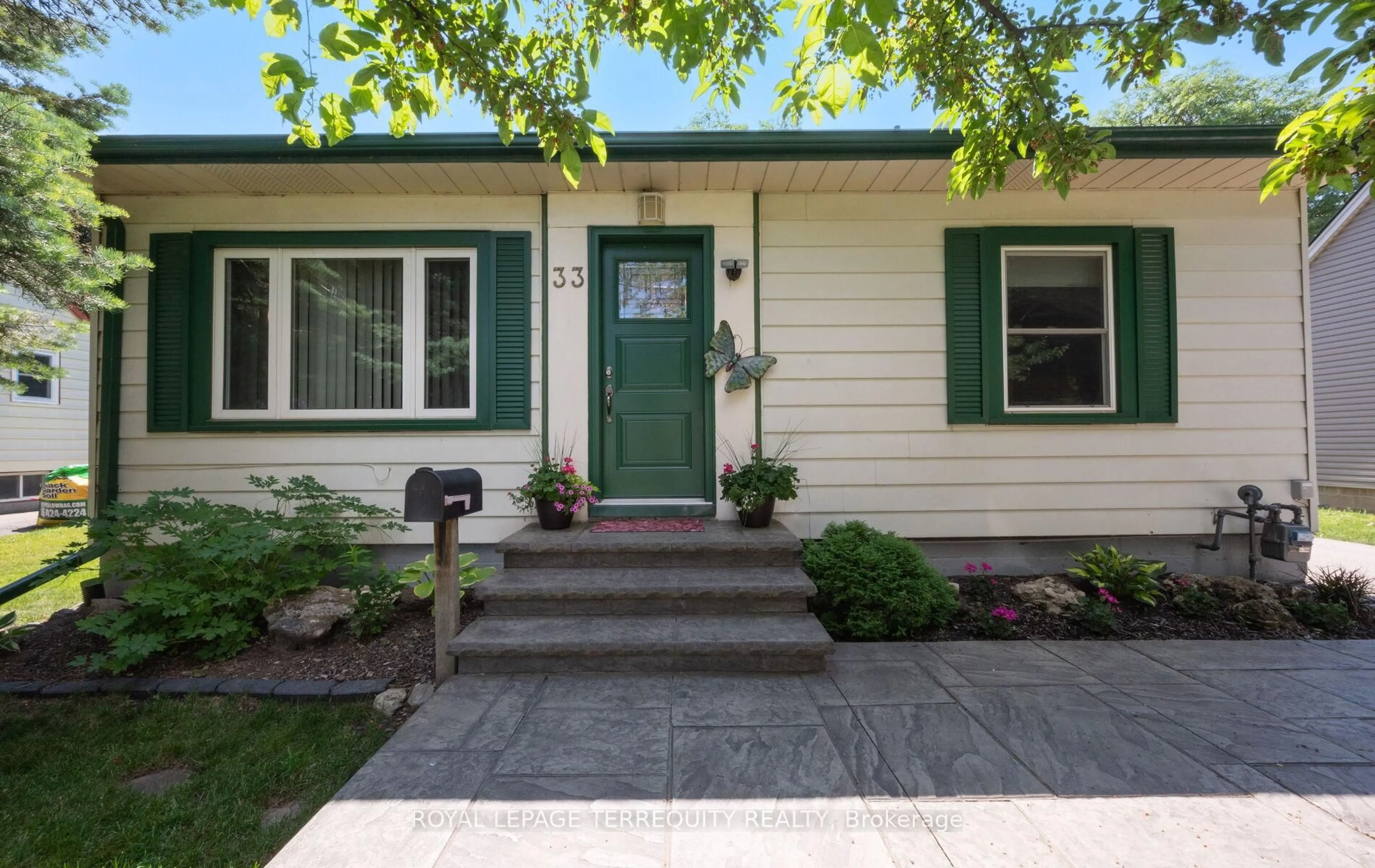 Home with vinyl exterior material, street for 33 Rogers Rd, Brampton Ontario L6X 1L7
