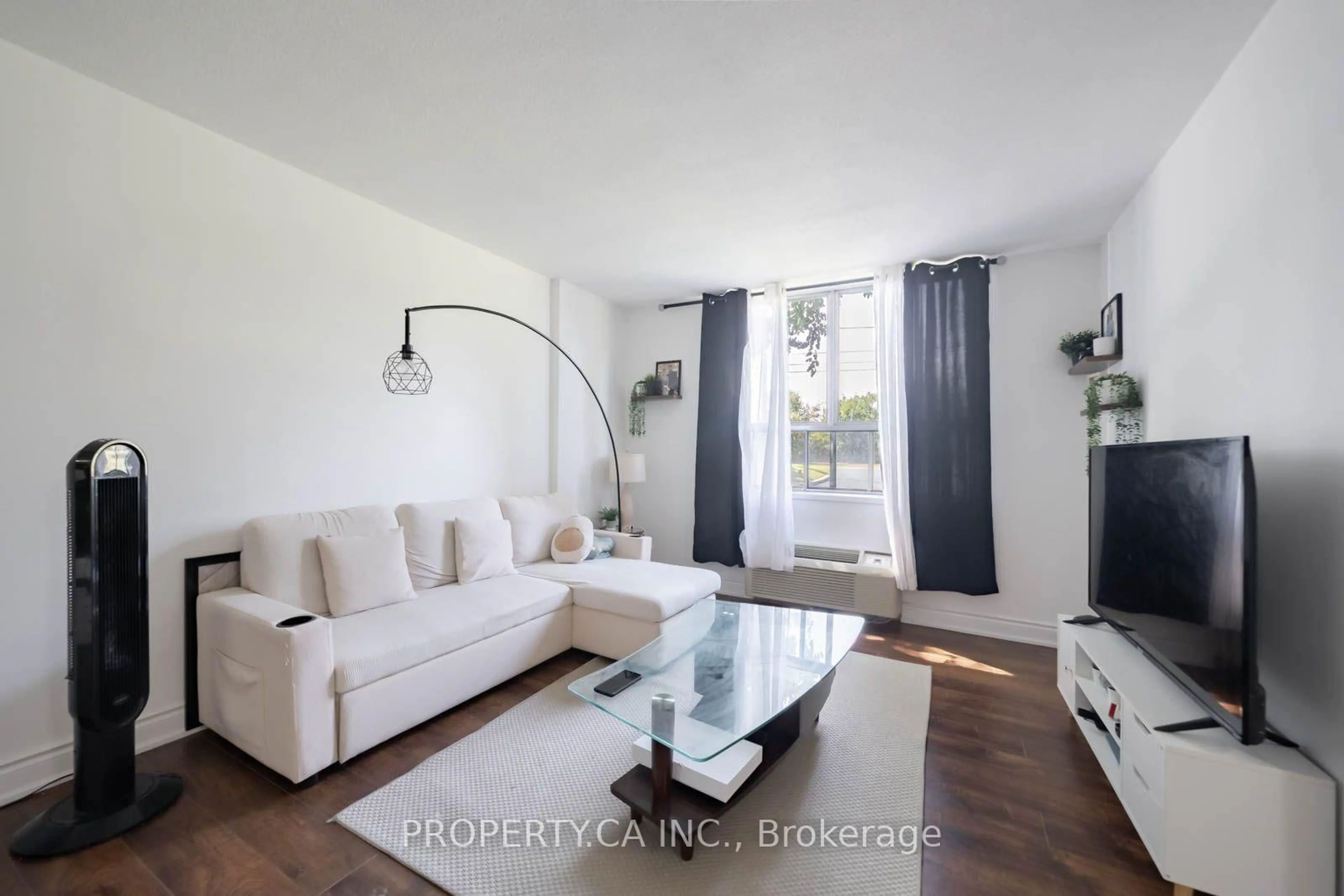 Living room with furniture, wood/laminate floor for 2835 Islington Ave #107, Toronto Ontario M9L 2K2