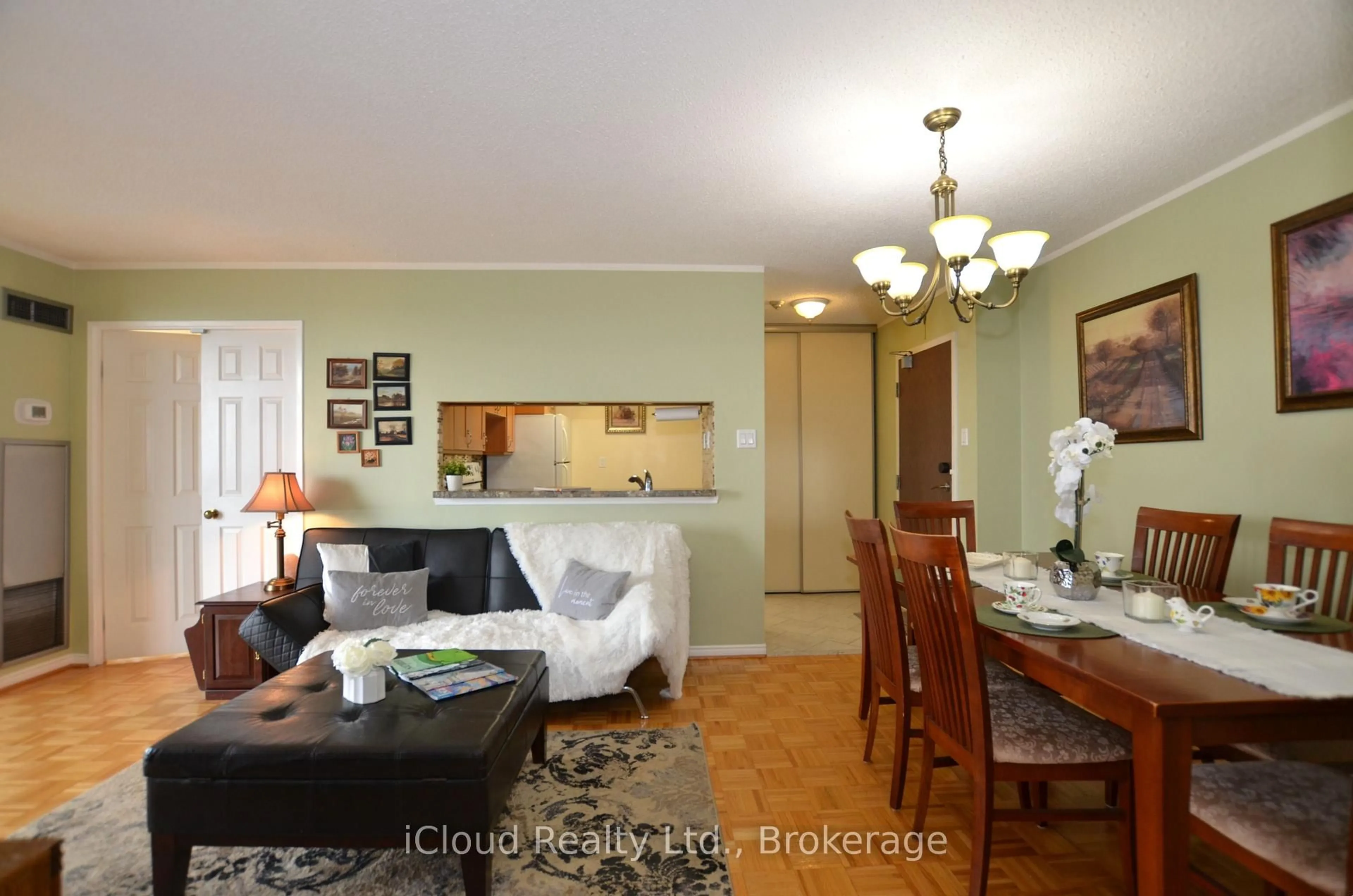 Living room with furniture, wood/laminate floor for 50 Kingsbridge Garden Circ #915, Mississauga Ontario L5R 1Y2