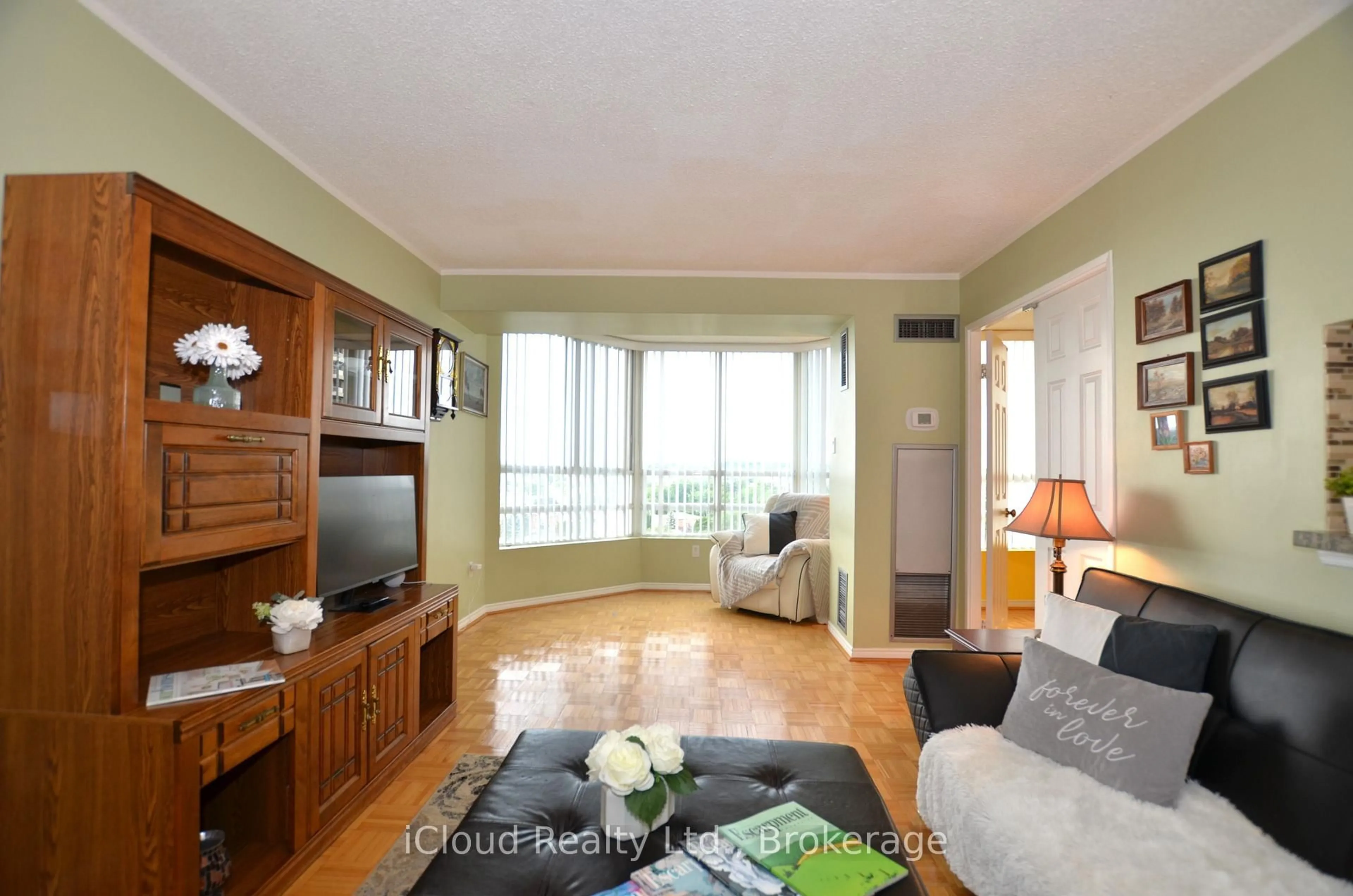 Living room with furniture, wood/laminate floor for 50 Kingsbridge Garden Circ #915, Mississauga Ontario L5R 1Y2