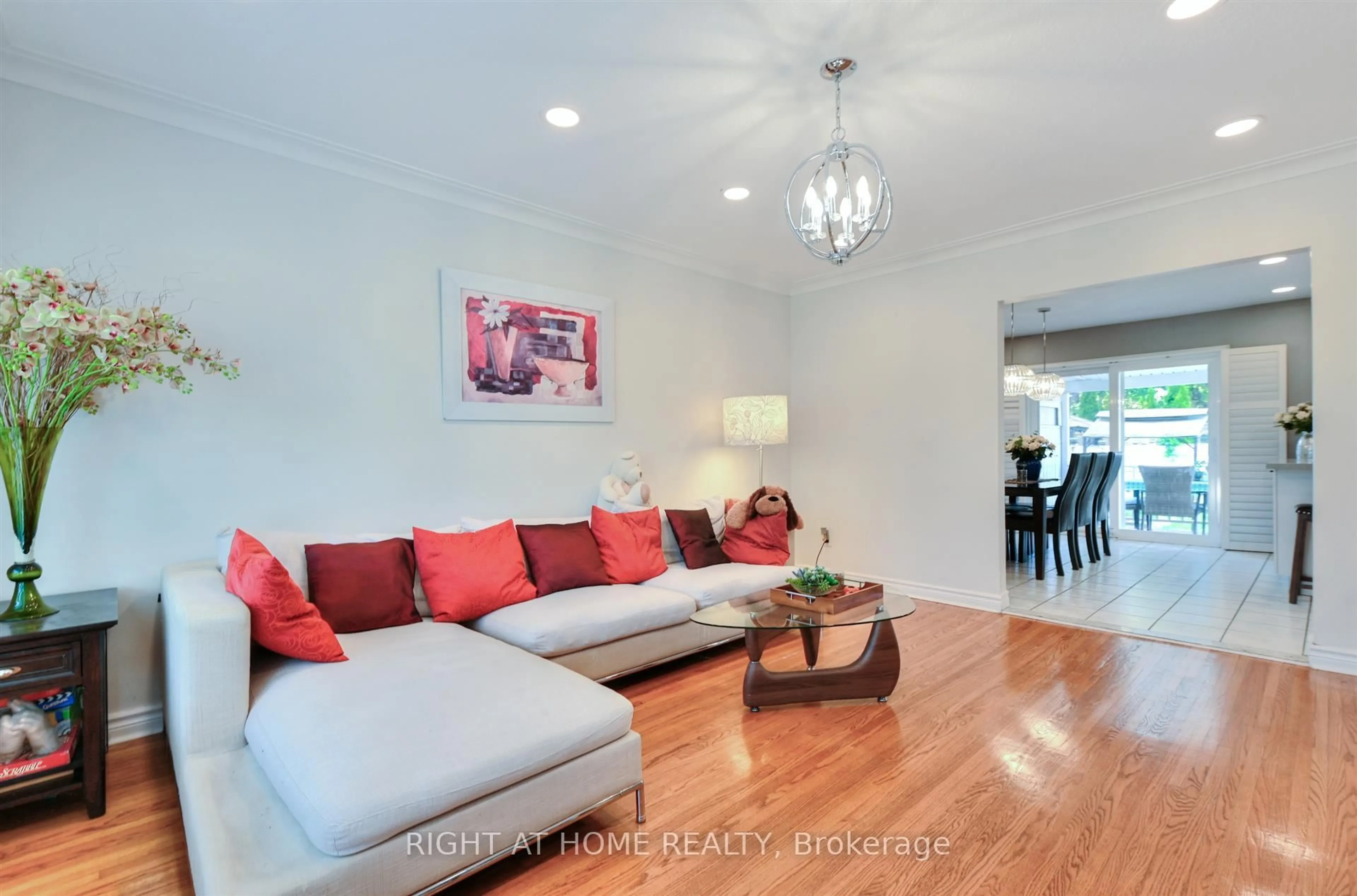 Living room with furniture, wood/laminate floor for 50 Chalkfarm Dr, Toronto Ontario M3L 1L2