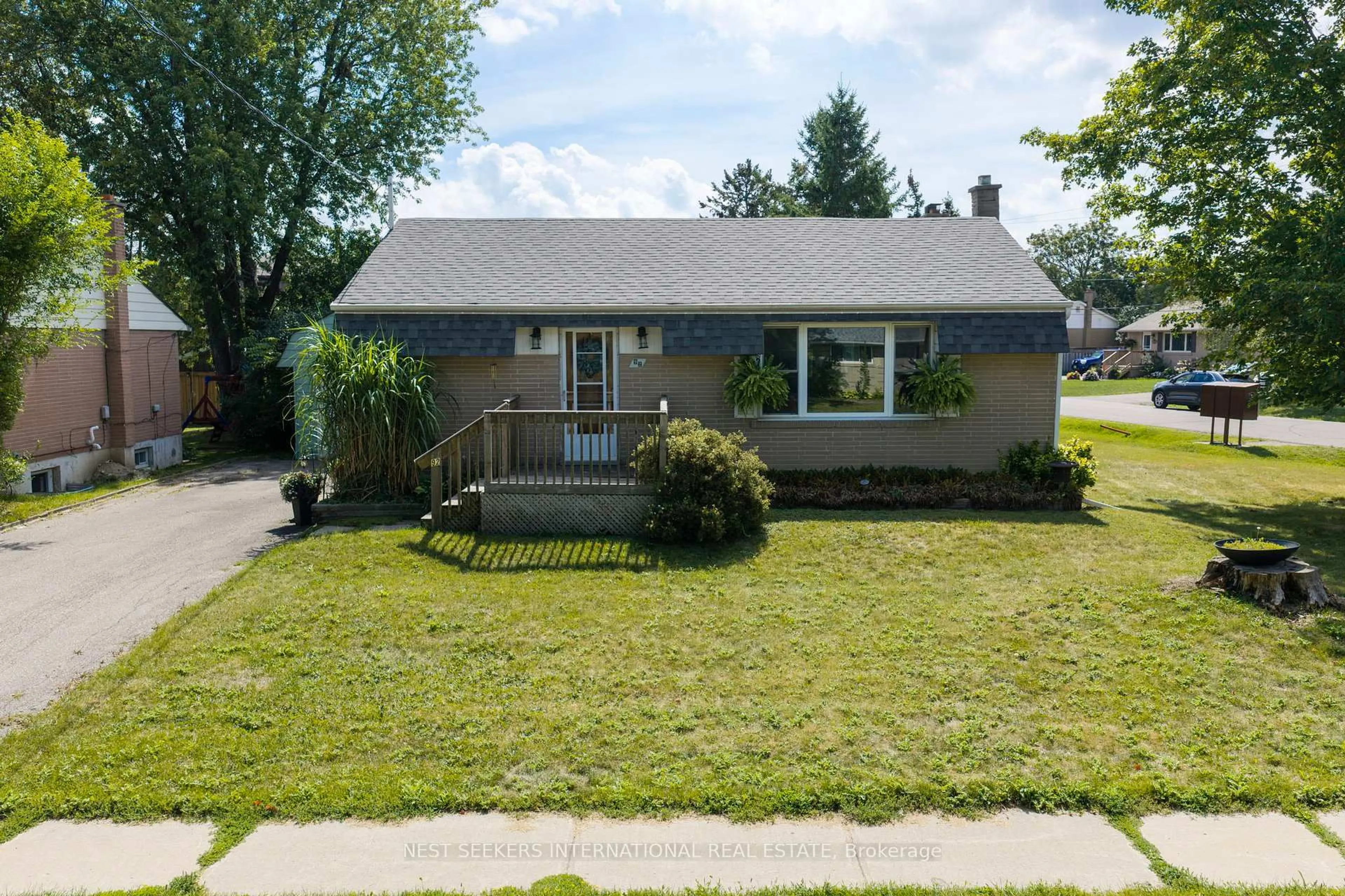 Home with vinyl exterior material, street for 92 Ellwood Dr, Caledon Ontario L7E 4W7