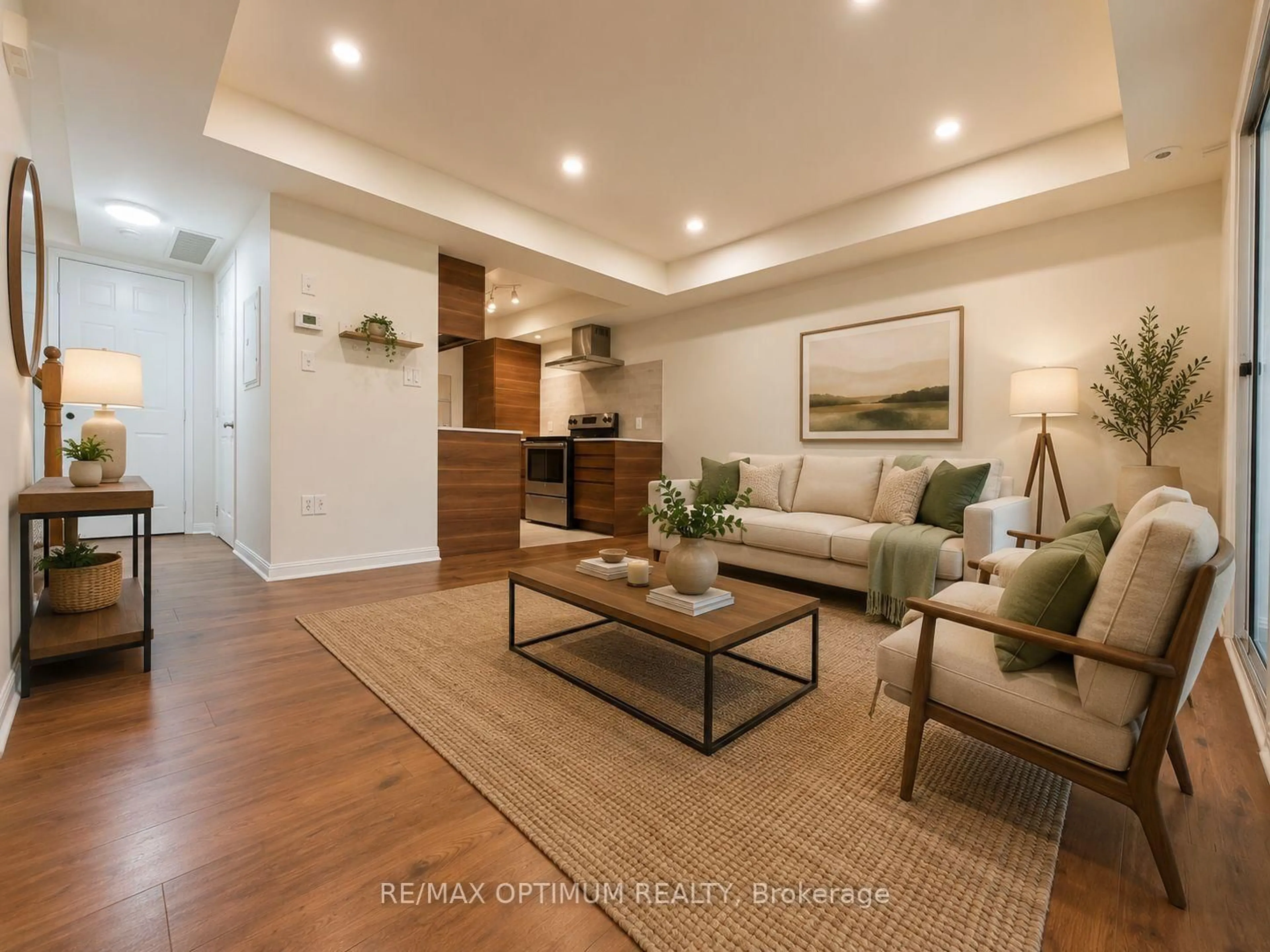 Living room with furniture, wood/laminate floor for 4620 Guildwood Way #17, Mississauga Ontario L5R 4H5