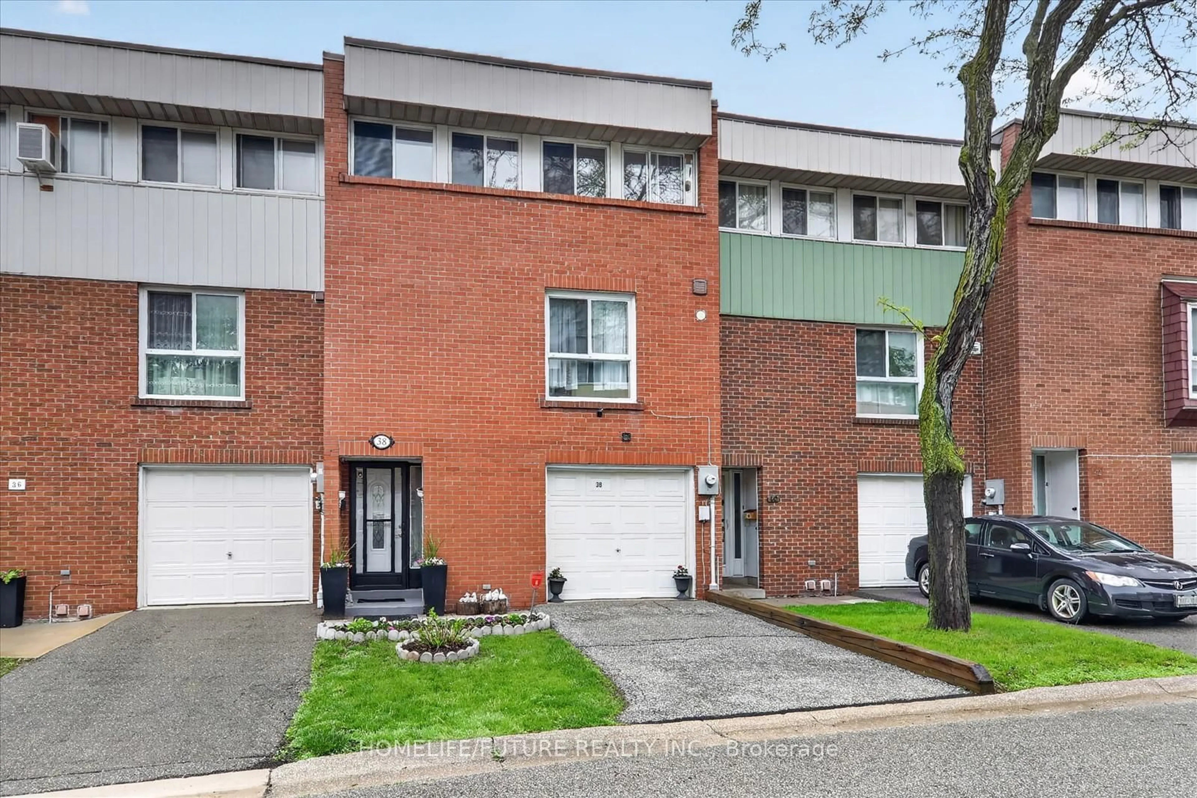 Home with brick exterior material, street for 38 John Cabot Way #70, Toronto Ontario M3N 2T7