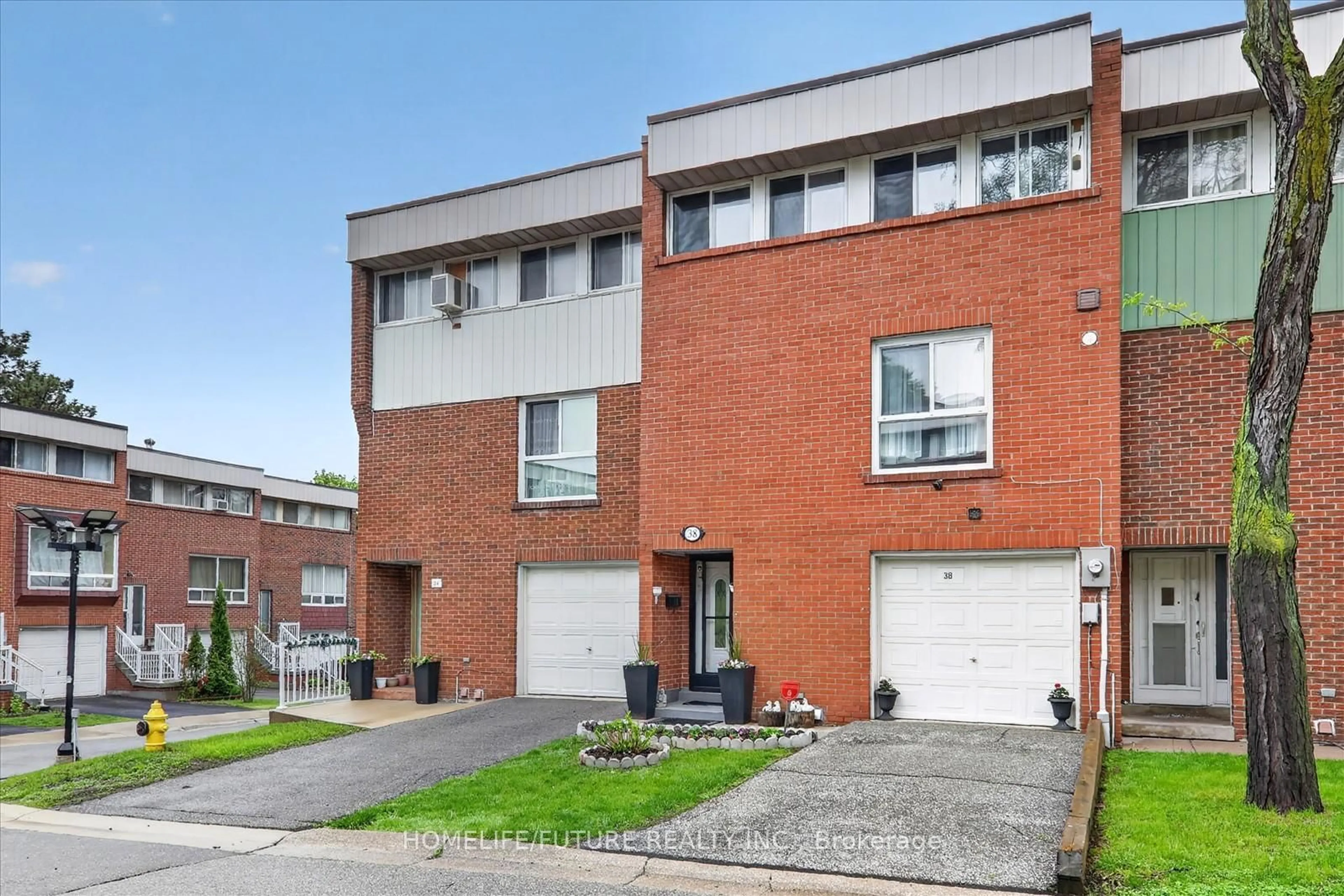 Home with brick exterior material, street for 38 John Cabot Way #70, Toronto Ontario M3N 2T7