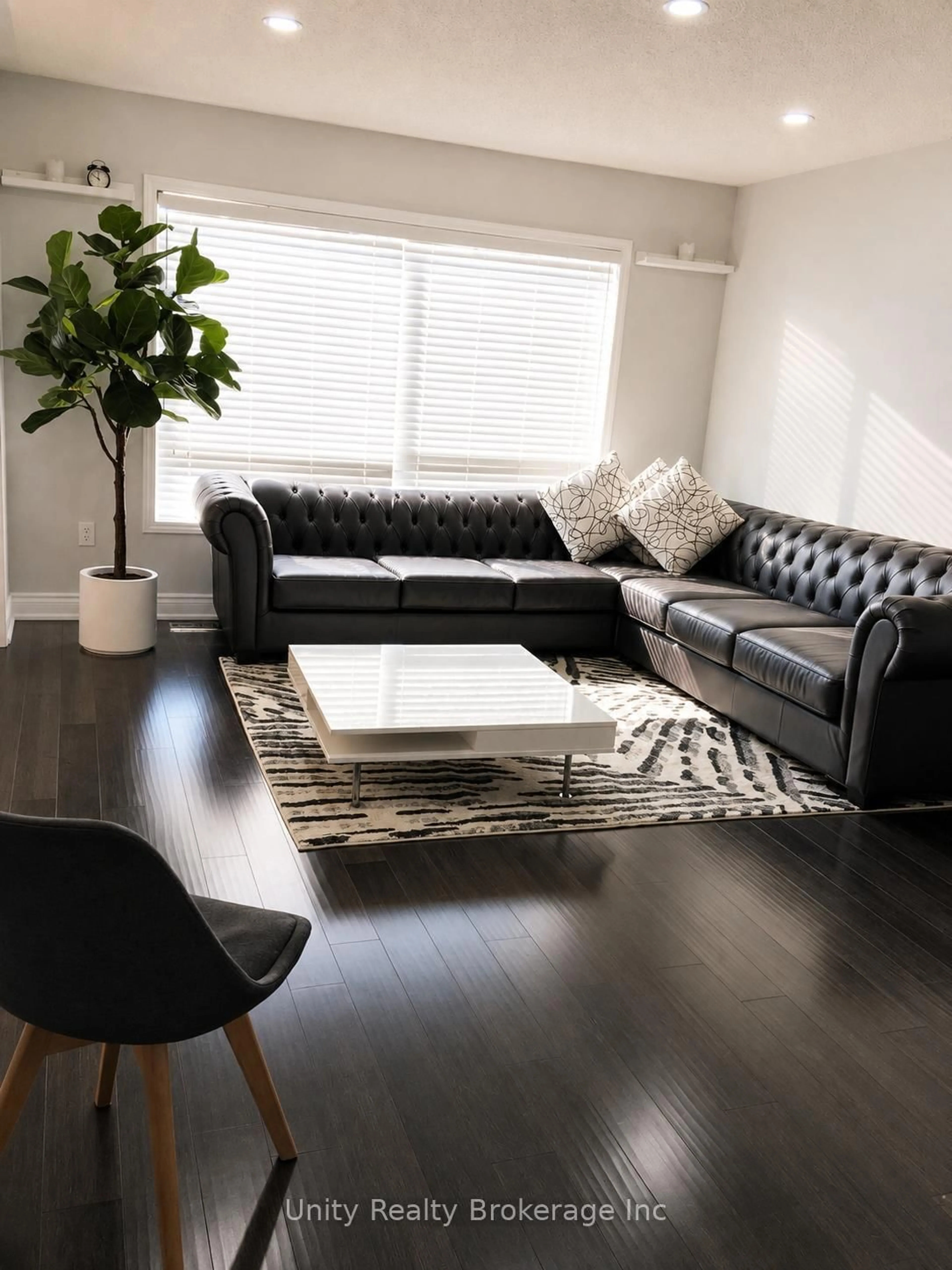 Living room with furniture, wood/laminate floor for 16 Benmore Cres, Brampton Ontario L6P 2S8
