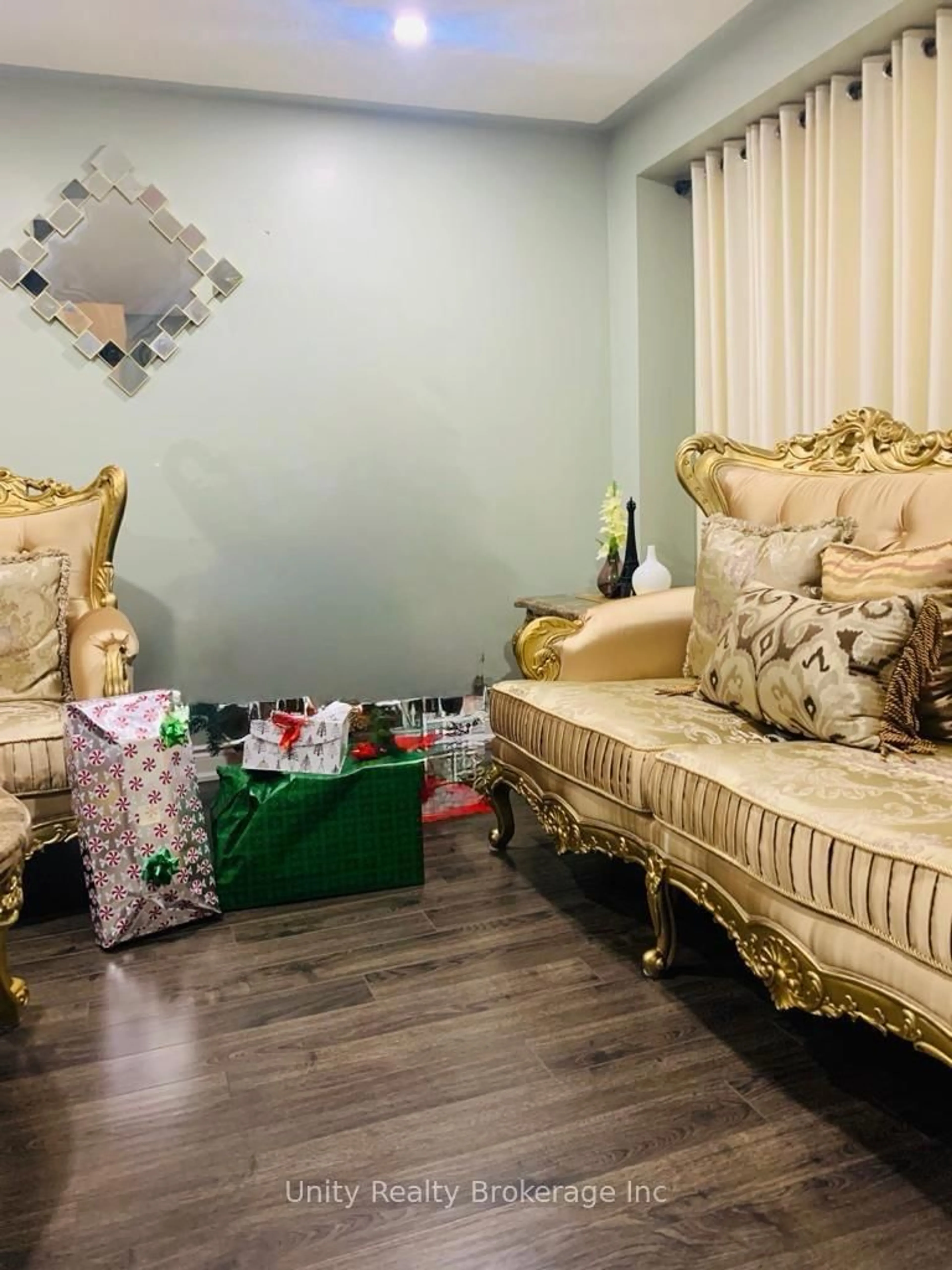 Living room with furniture, wood/laminate floor for 16 Benmore Cres, Brampton Ontario L6P 2S8