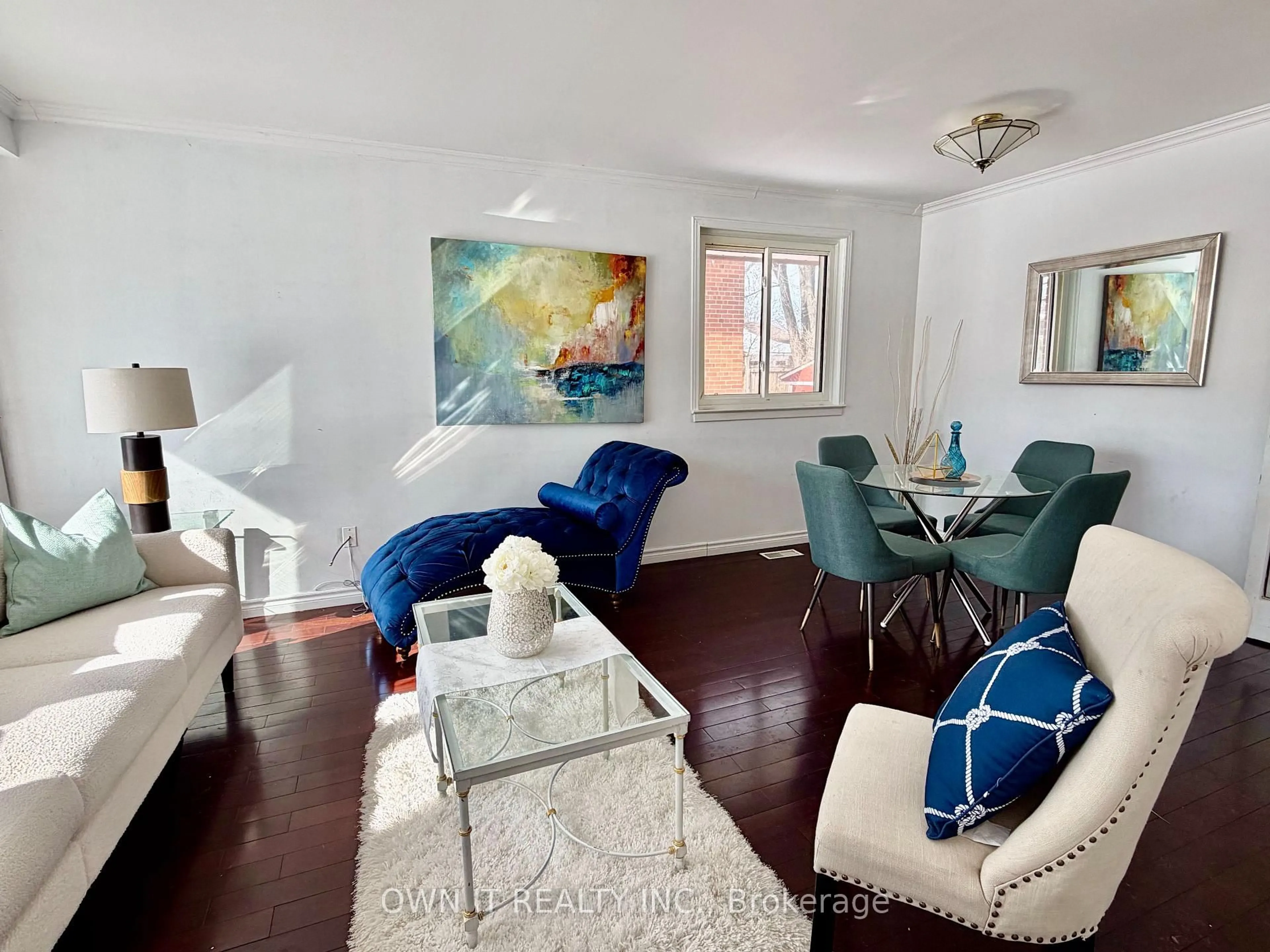 Living room with furniture, wood/laminate floor for 68 Campbell Dr, Brampton Ontario L6X 2H7