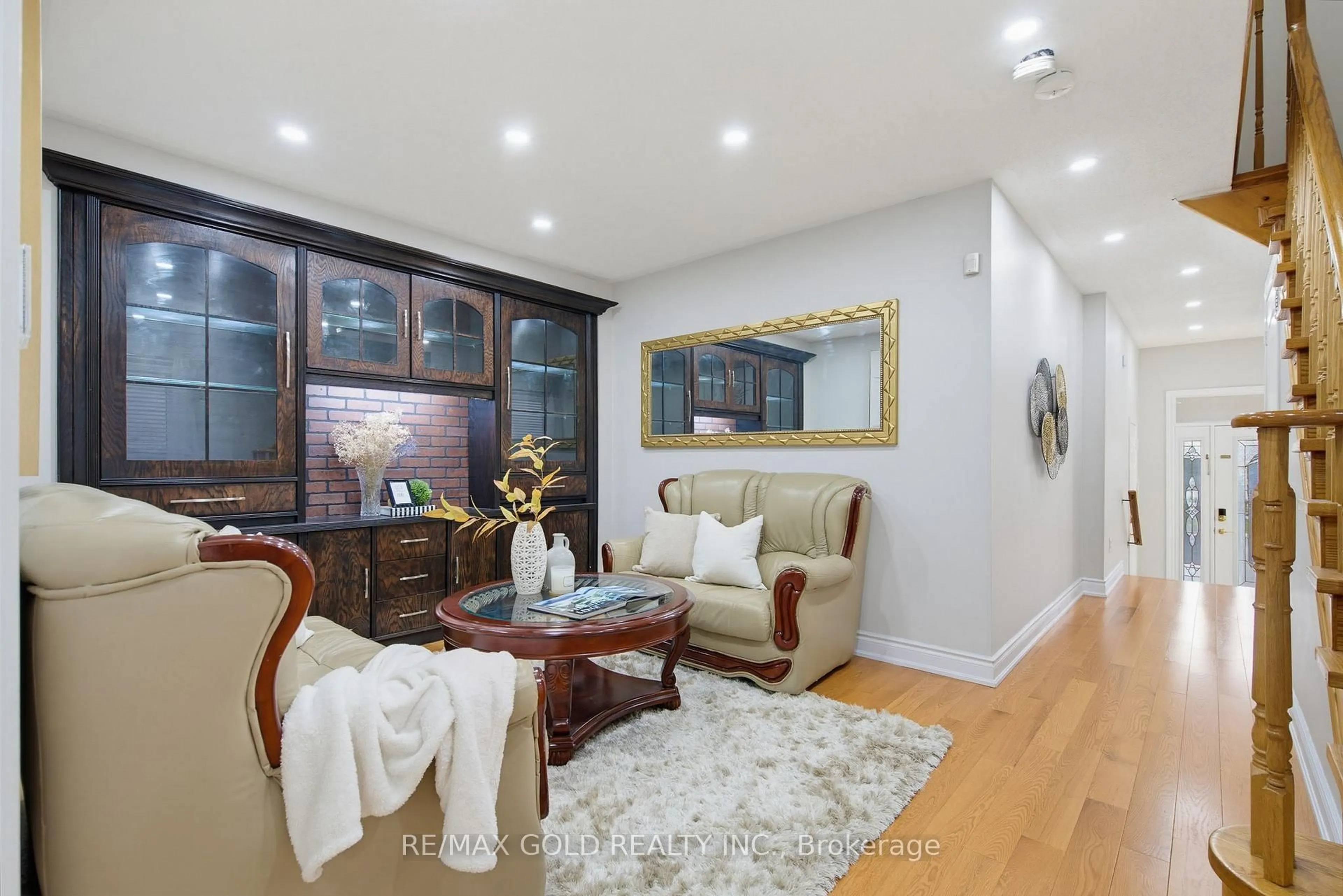 Living room with furniture, wood/laminate floor for 46 Sand Cherry Cres, Brampton Ontario L6R 3B1