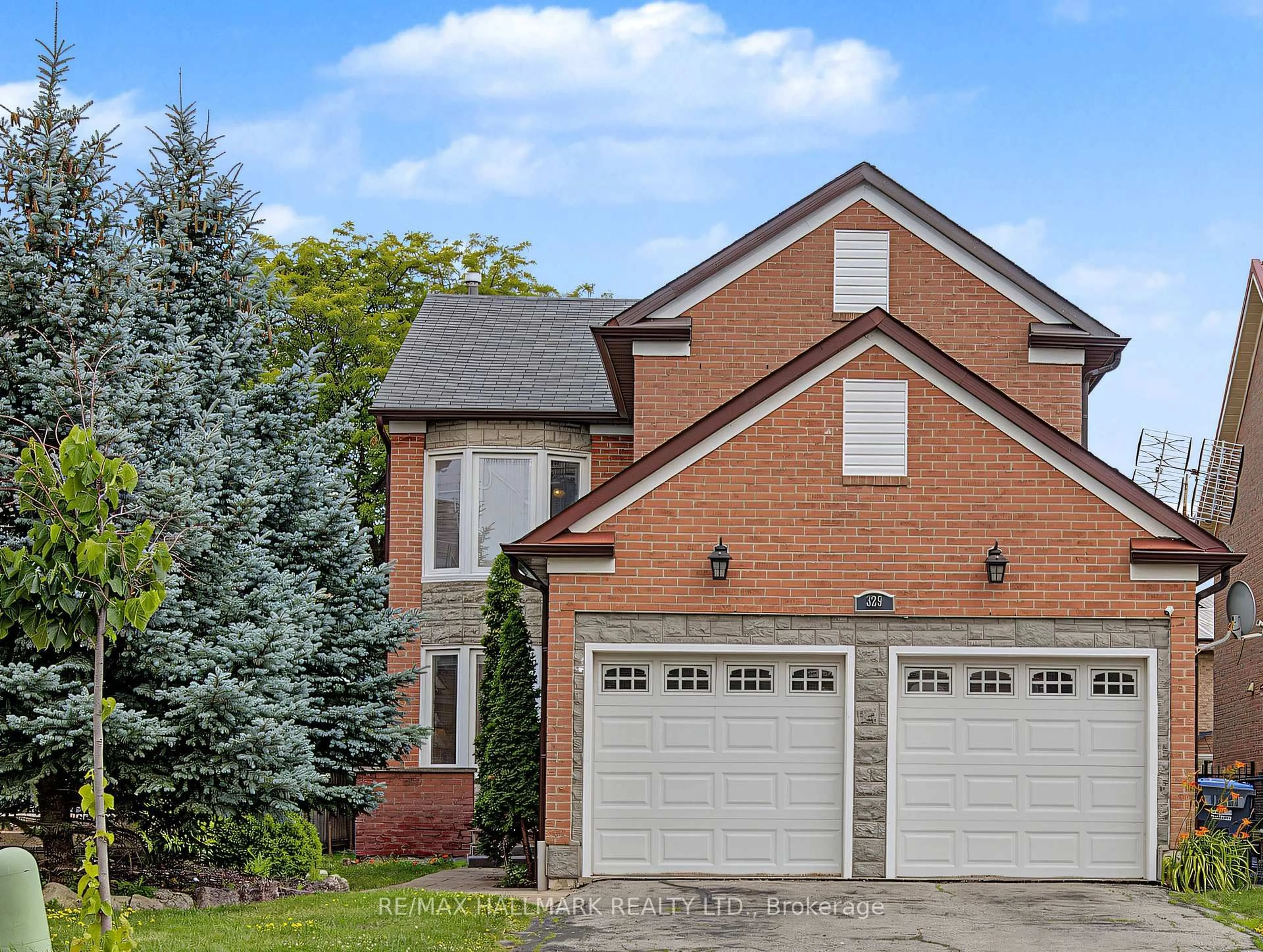 Home with brick exterior material, street for 329 Kingsbridge Garden Circ, Mississauga Ontario L5R 1K9