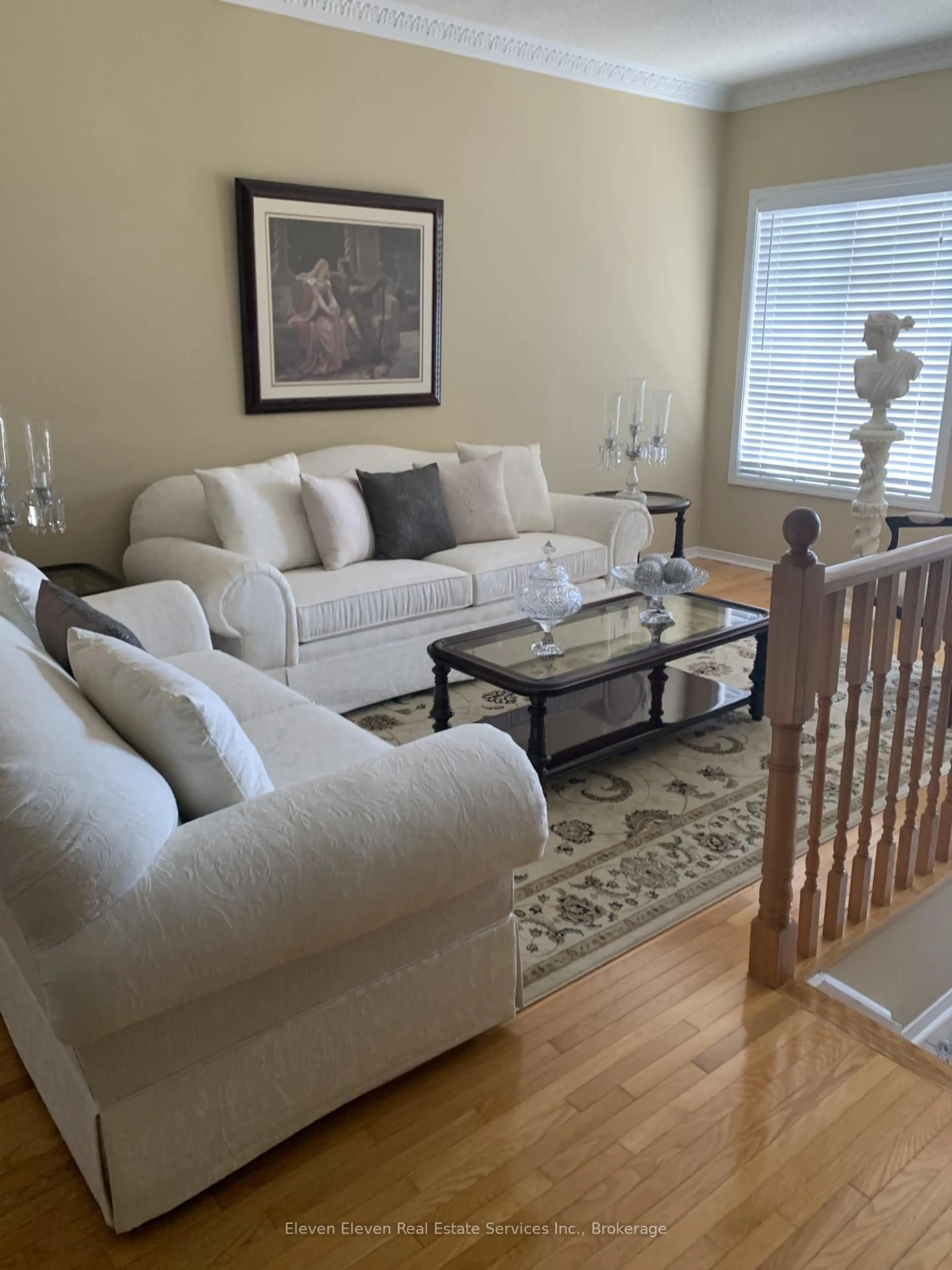 Living room with furniture, wood/laminate floor for 301 Van Kirk Dr, Brampton Ontario L7A 1M3