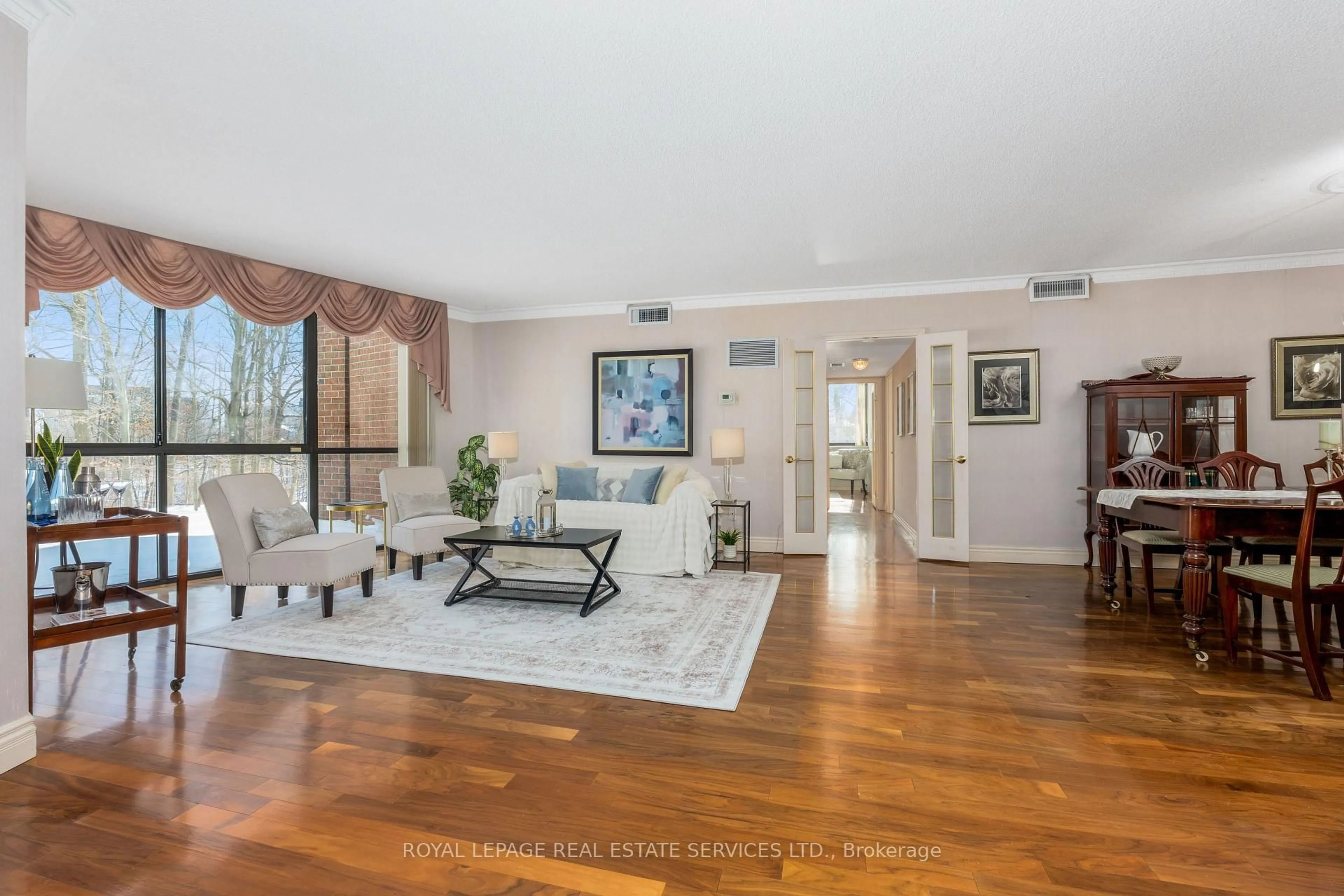 Living room with furniture, unknown for 1240 Marlborough Crt #110, Oakville Ontario L6H 3K7