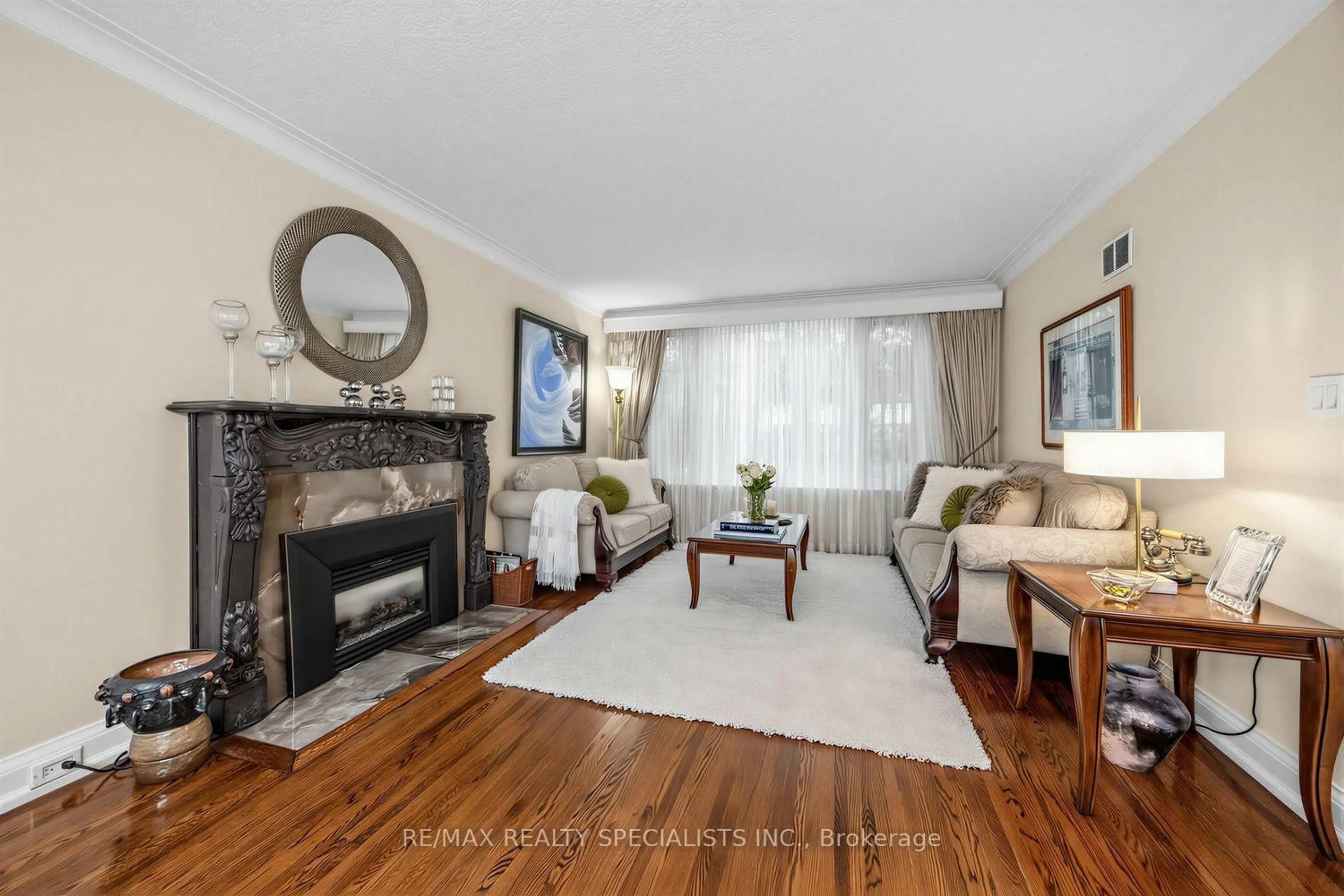 Living room with furniture, wood/laminate floor for 1211 Royal York Rd, Toronto Ontario M9A 4B5