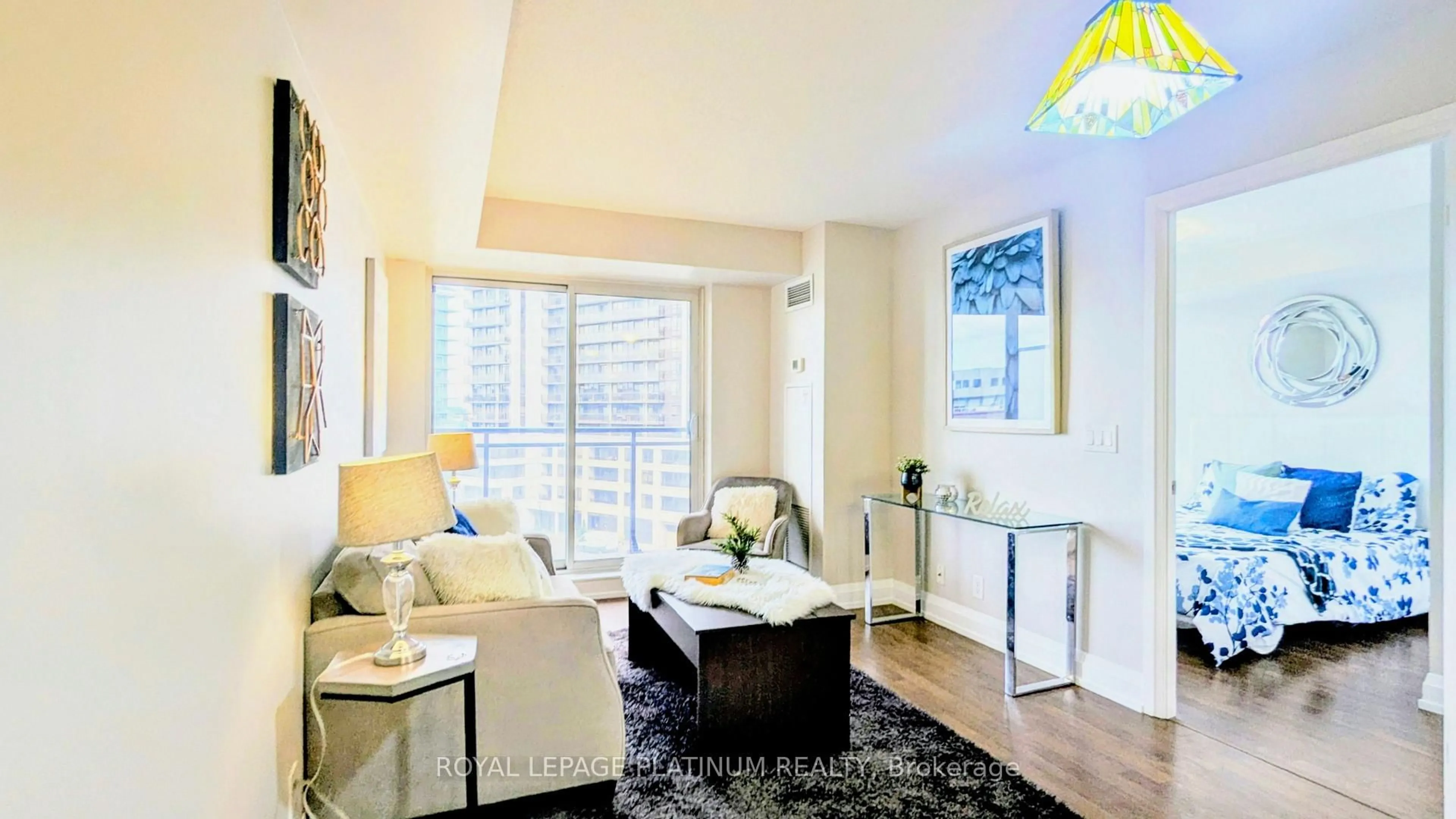 Living room with furniture, wood/laminate floor for 1070 Sheppard Ave #503, Toronto Ontario M3J 0G8