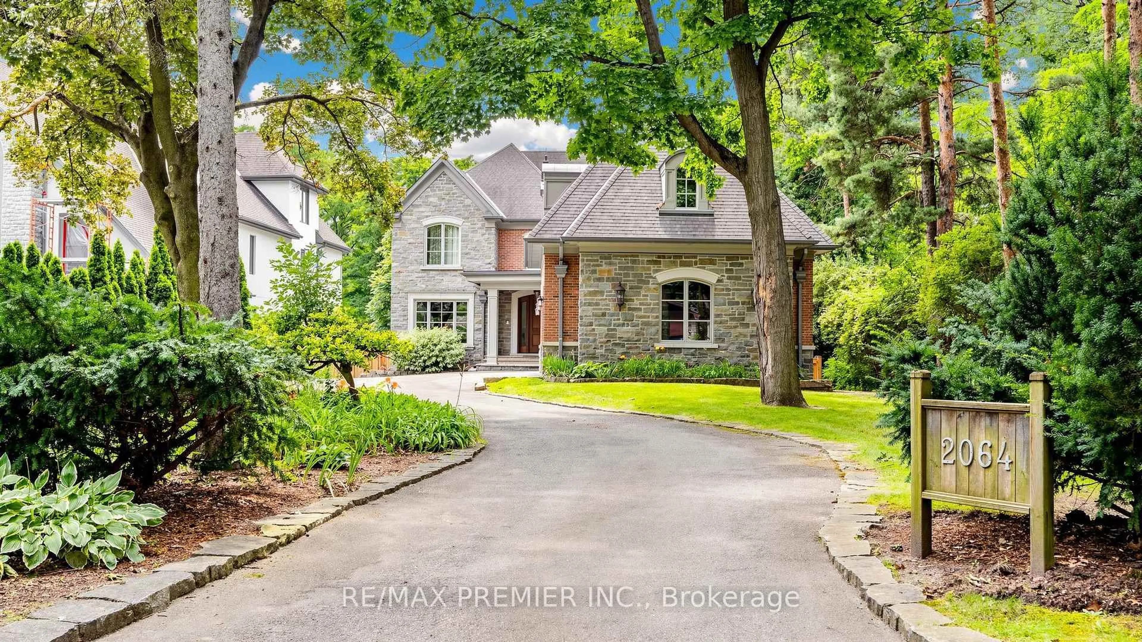 Home with brick exterior material, street for 2064 Dickson Rd, Mississauga Ontario L5B 1Y6