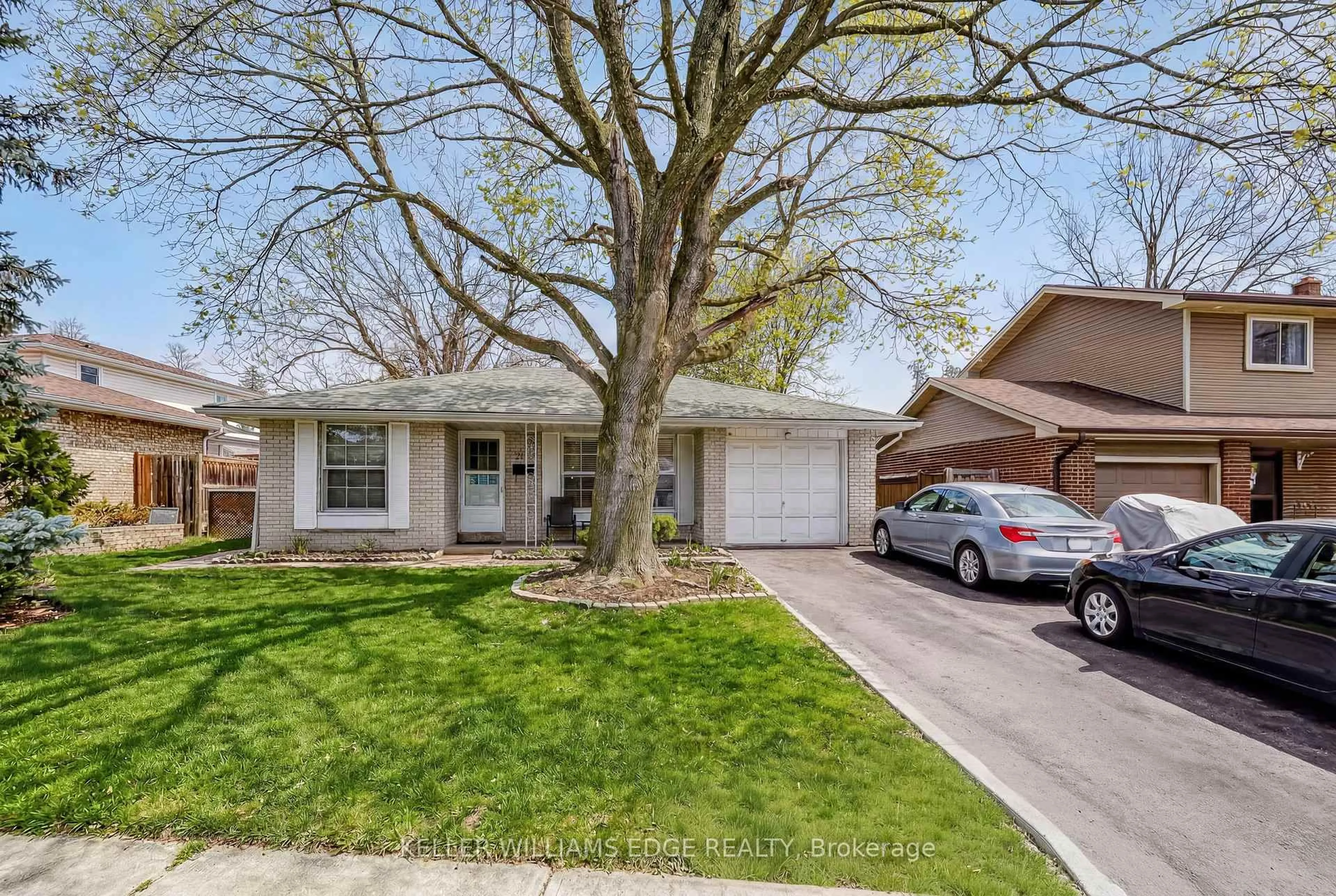 Home with vinyl exterior material, street for 2145 Sandringham Dr, Burlington Ontario L7P 1T8