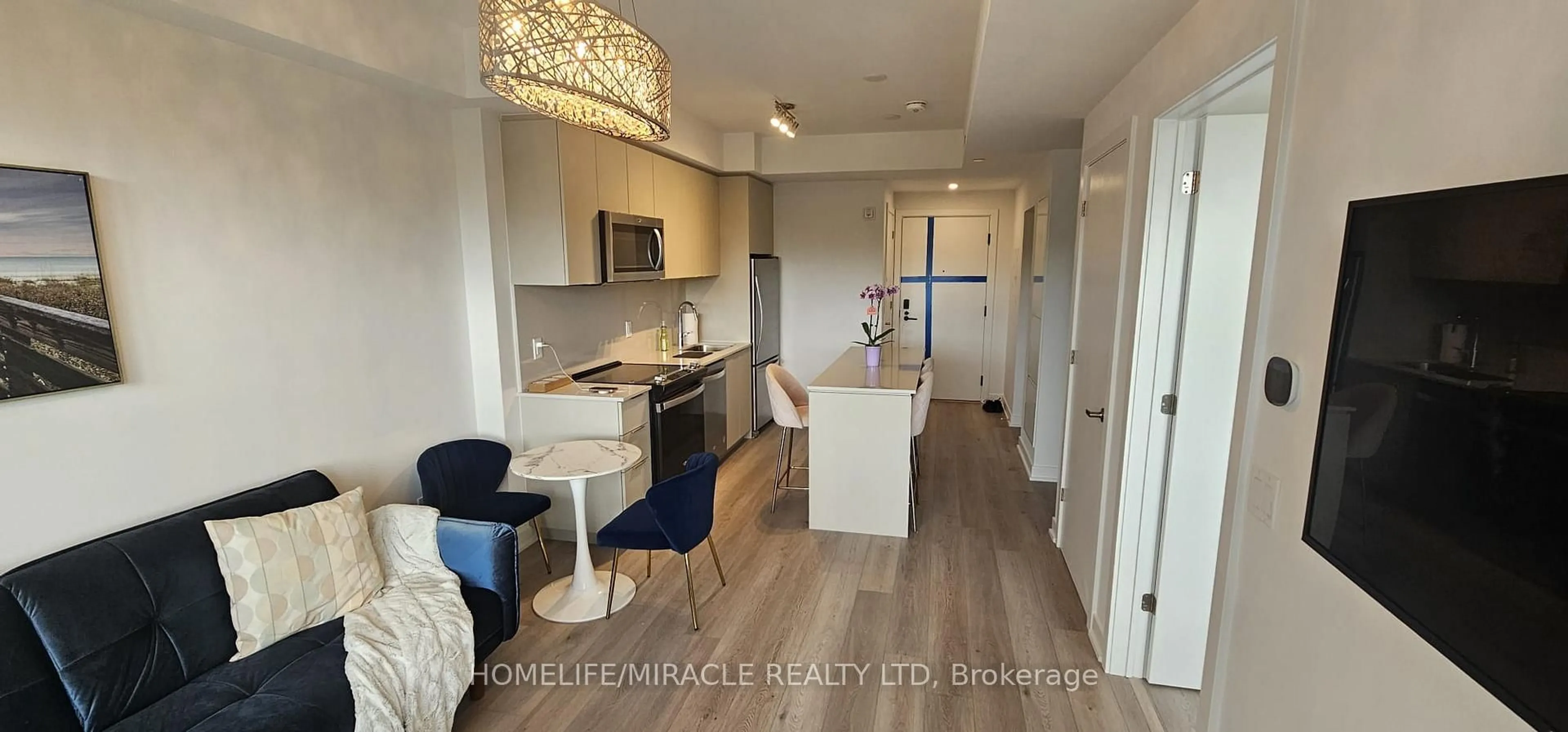 Open concept kitchen, wood/laminate floor for 770 Whitlock Ave #408, Milton Ontario L9E 2B2