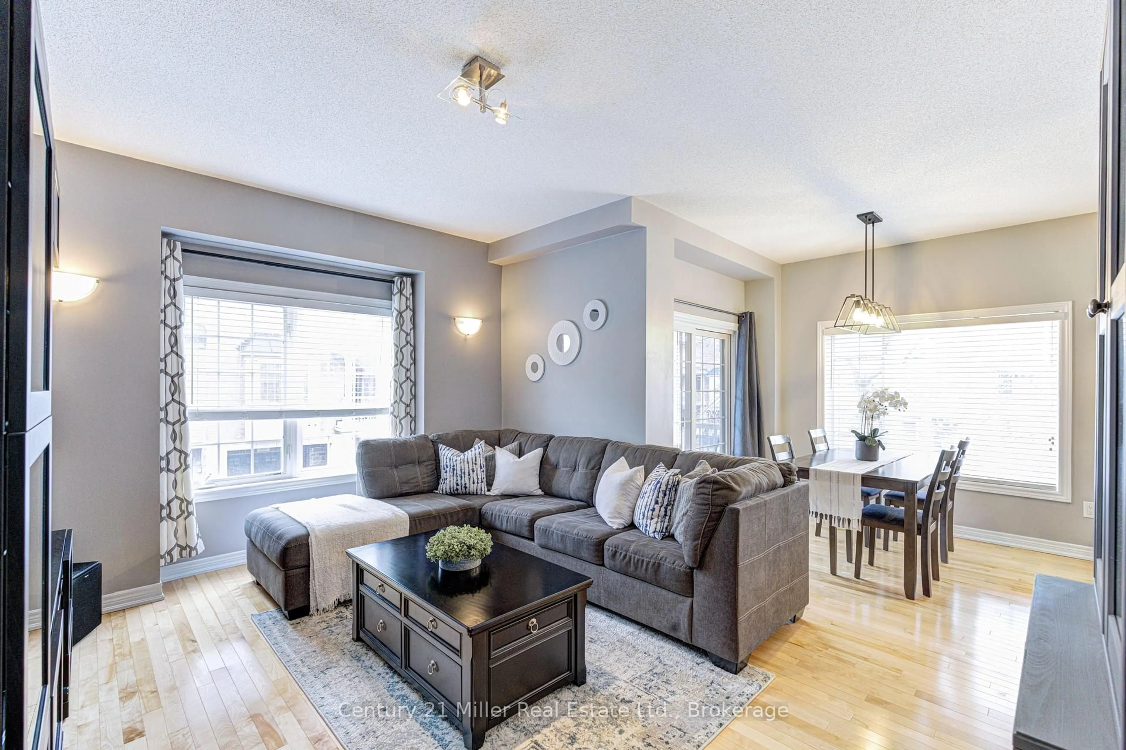 Living room with furniture, wood/laminate floor for 1401 Plains Rd #87, Burlington Ontario L7R 0C2