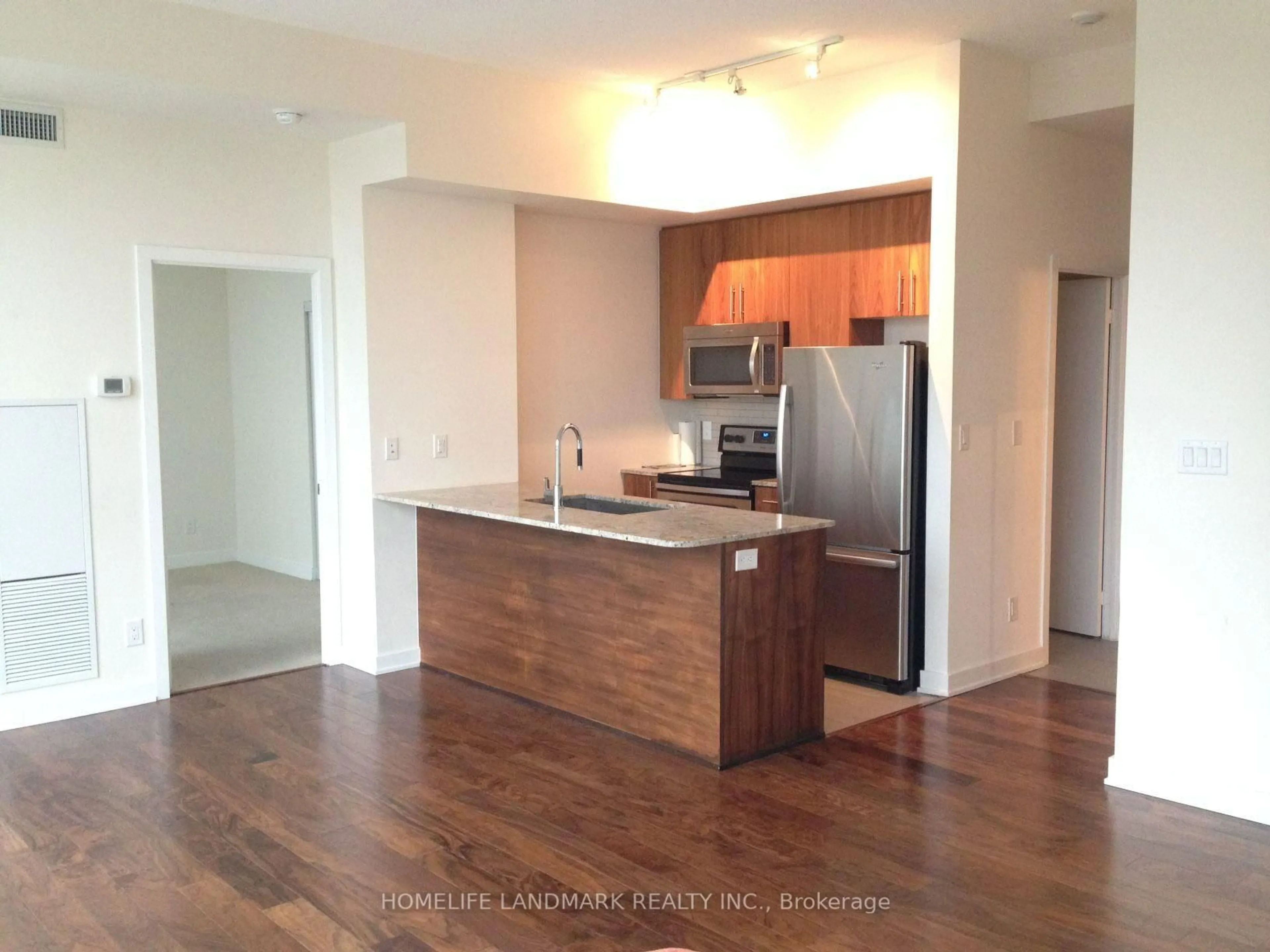 Open concept kitchen, wood/laminate floor for 4099 Brickstone Mews #507, Mississauga Ontario L5B 0G2