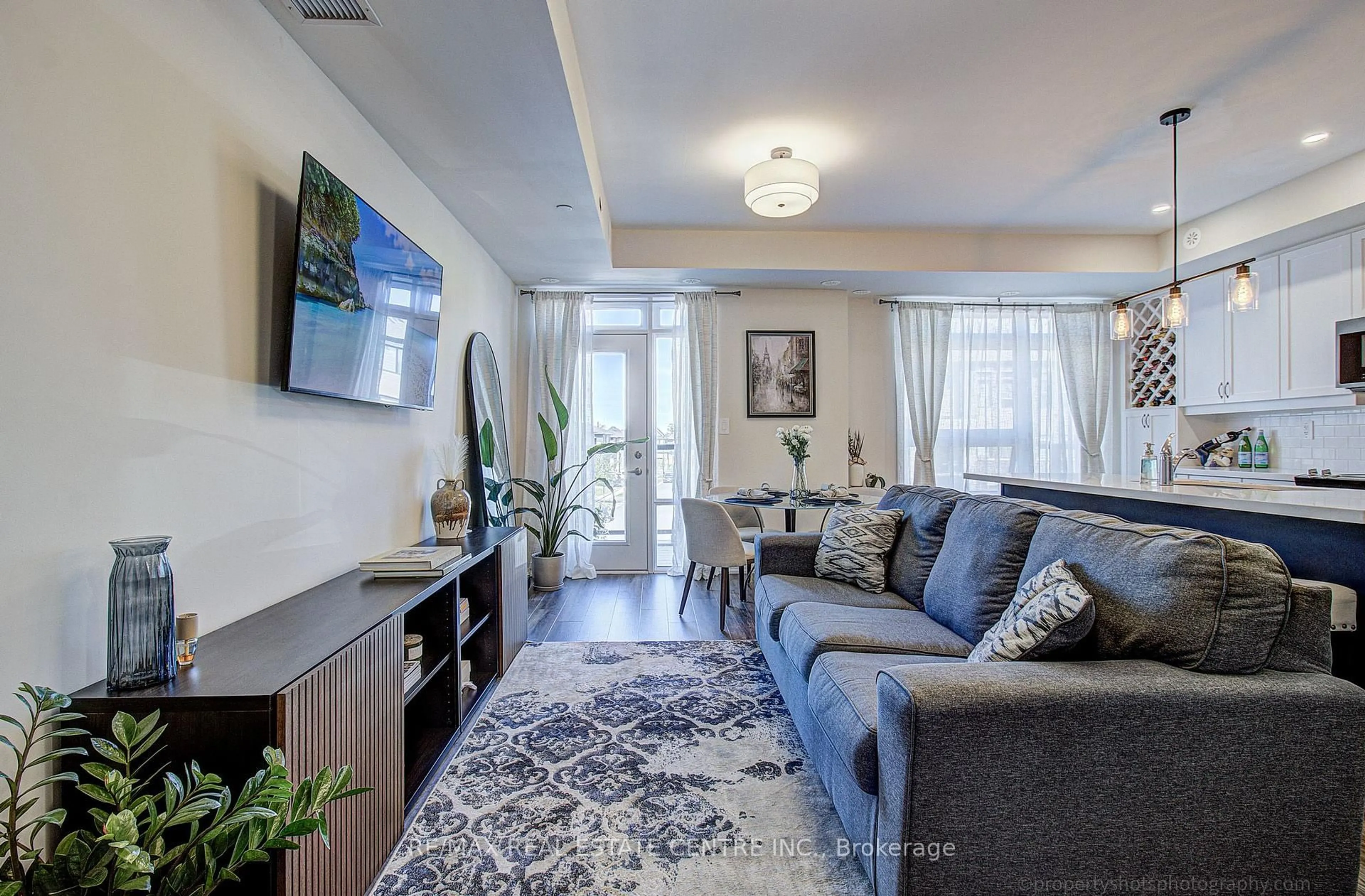 Living room with furniture, unknown for 1569 Rose Way #116, Milton Ontario L9E 1N4