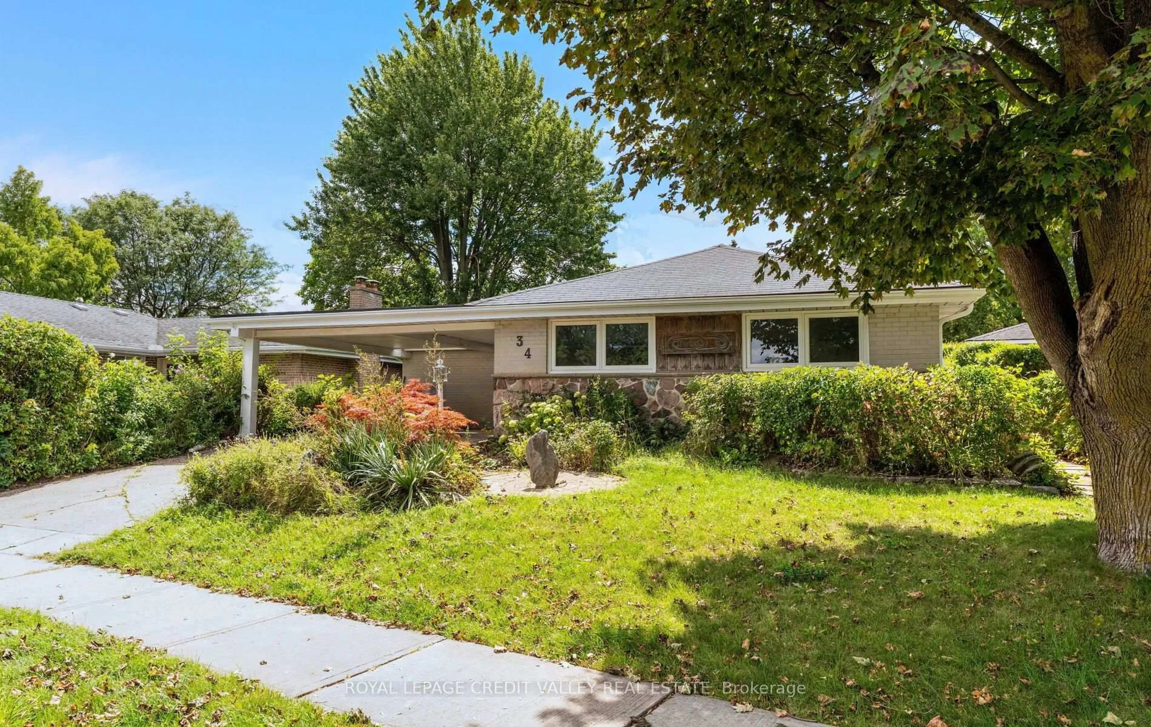 Home with brick exterior material, street for 34 Abbey Rd, Brampton Ontario L6W 2T8