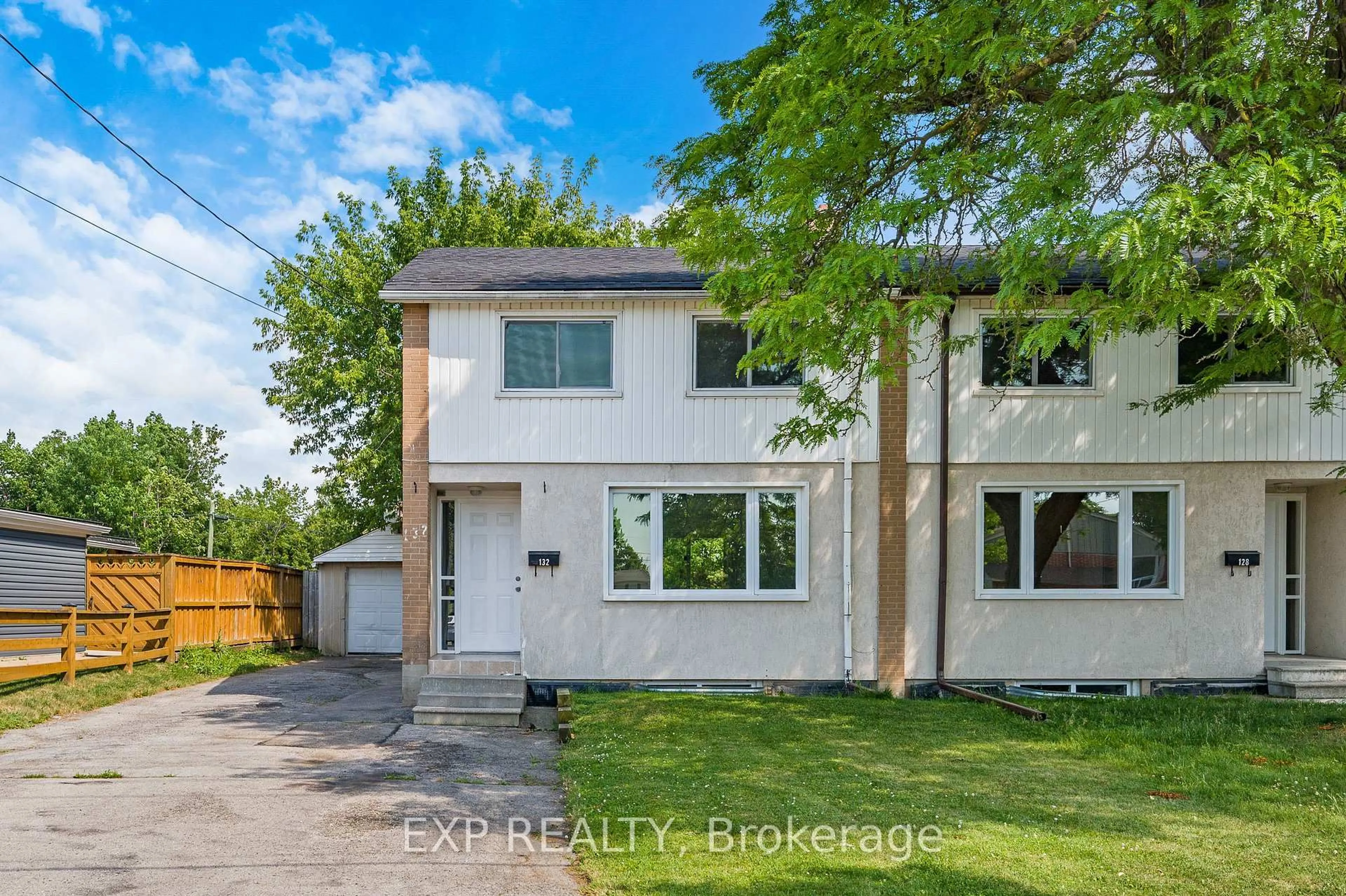 A pic from outside/outdoor area/front of a property/back of a property/a pic from drone, street for 132 Heslop Rd, Milton Ontario L9T 1B4
