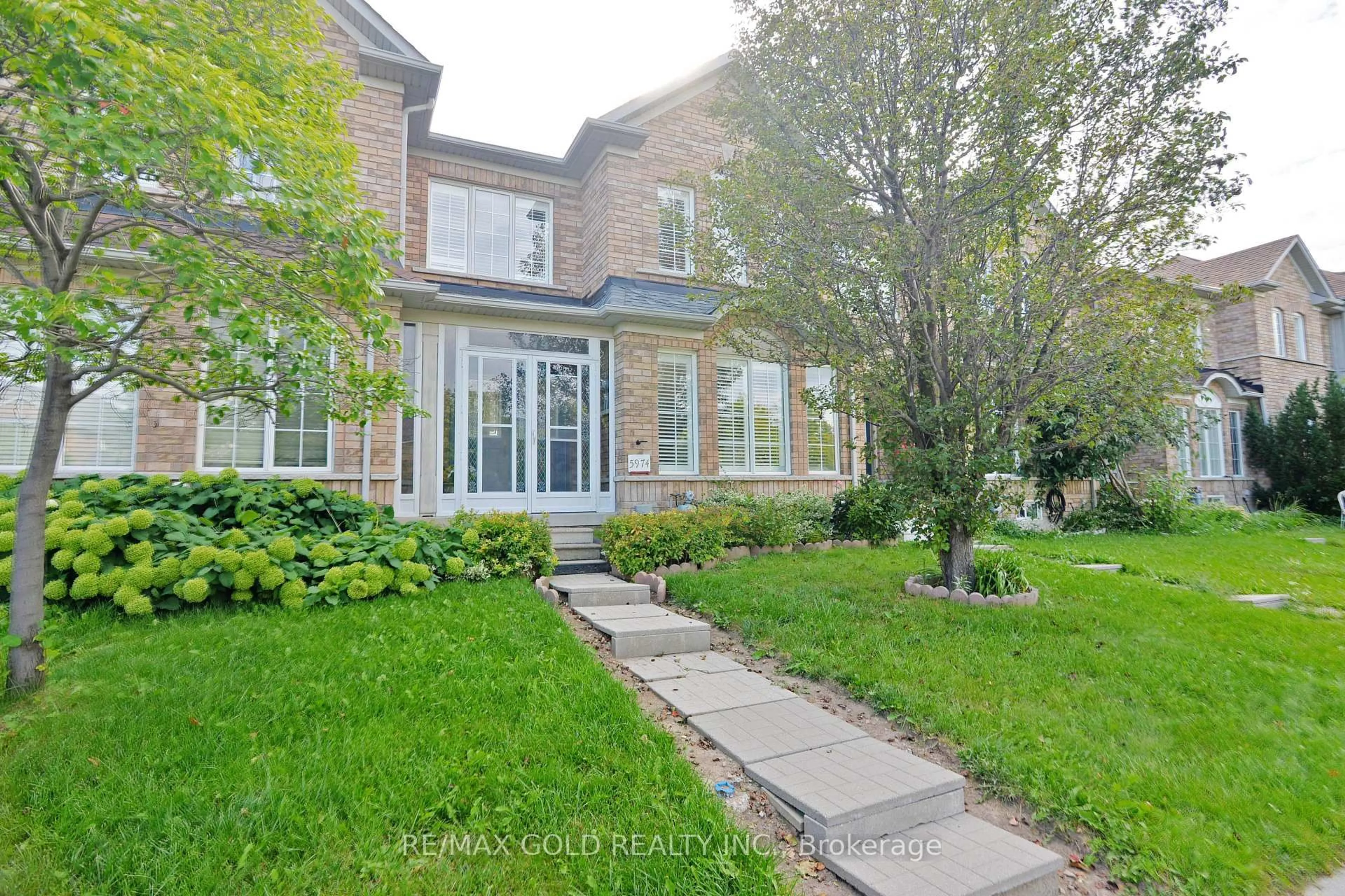 Home with brick exterior material, street for 5974 Tenth Line, Mississauga Ontario L5M 6S9