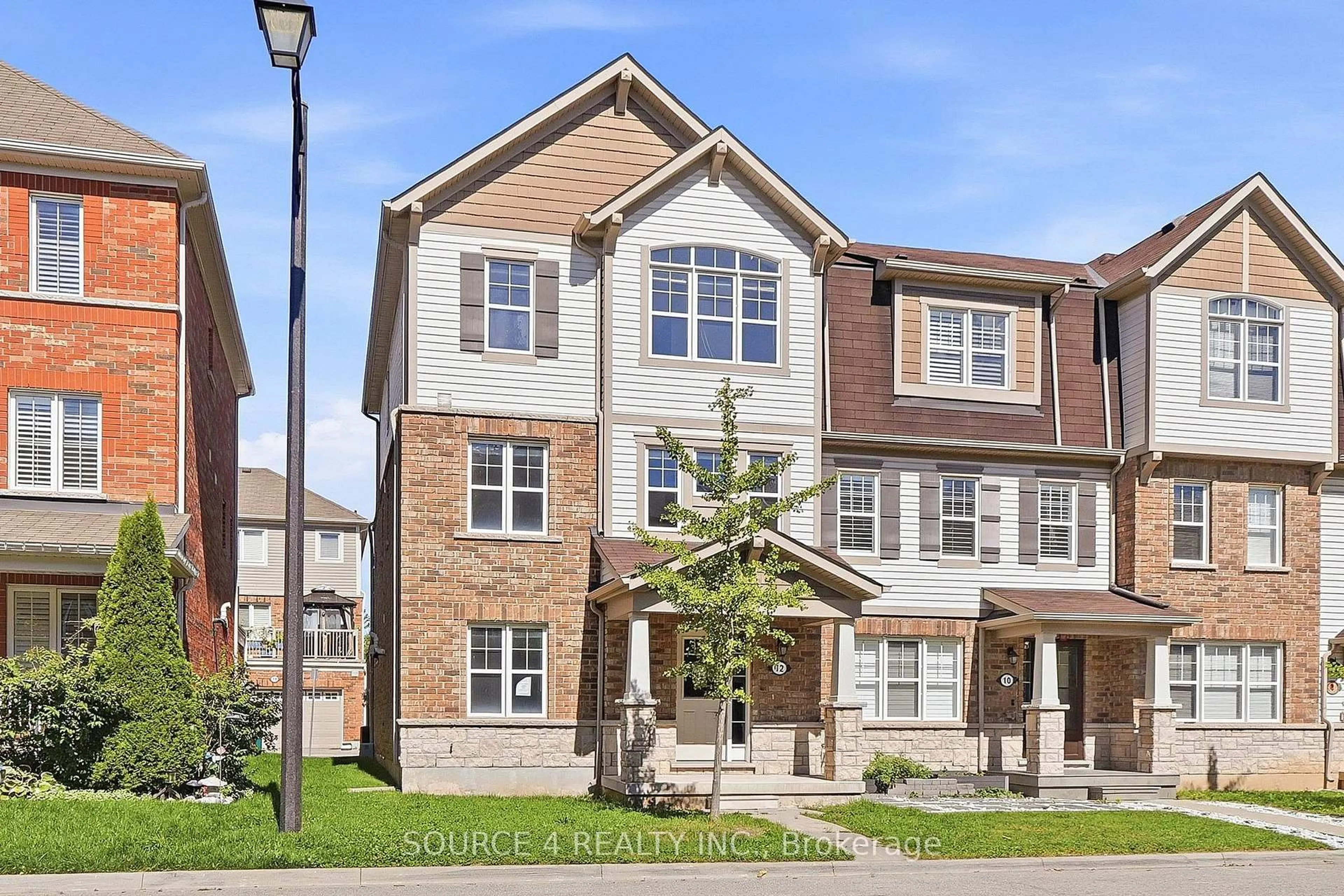 Home with brick exterior material, street for 12 Tight Crt, Milton Ontario L9T 8S3