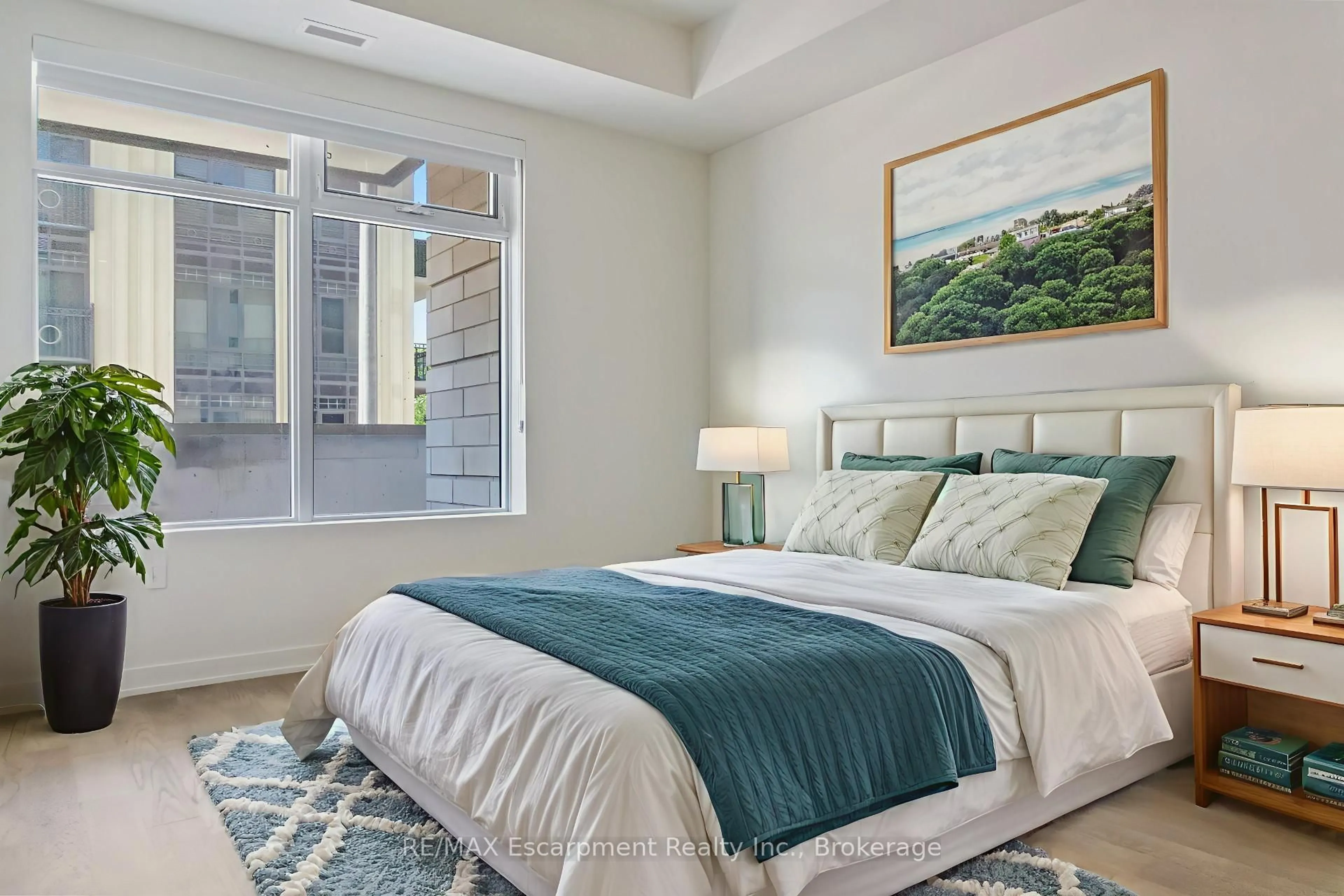 Bedroom with bed, carpet floor for 123 Maurice Dr #216, Oakville Ontario L6K 2W6