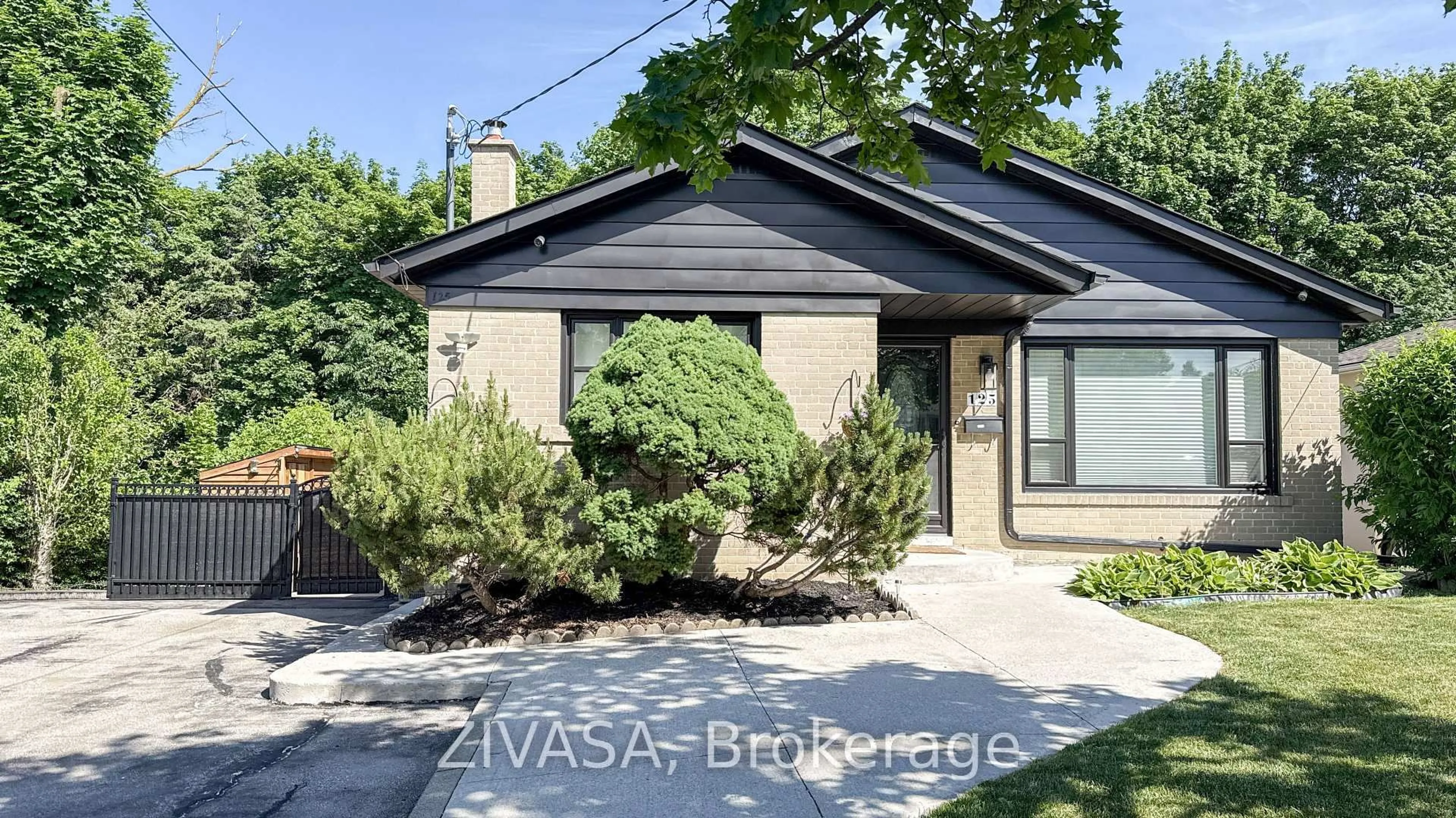 Home with brick exterior material, street for 125 Jeffcoat Dr, Toronto Ontario M9W 3B9