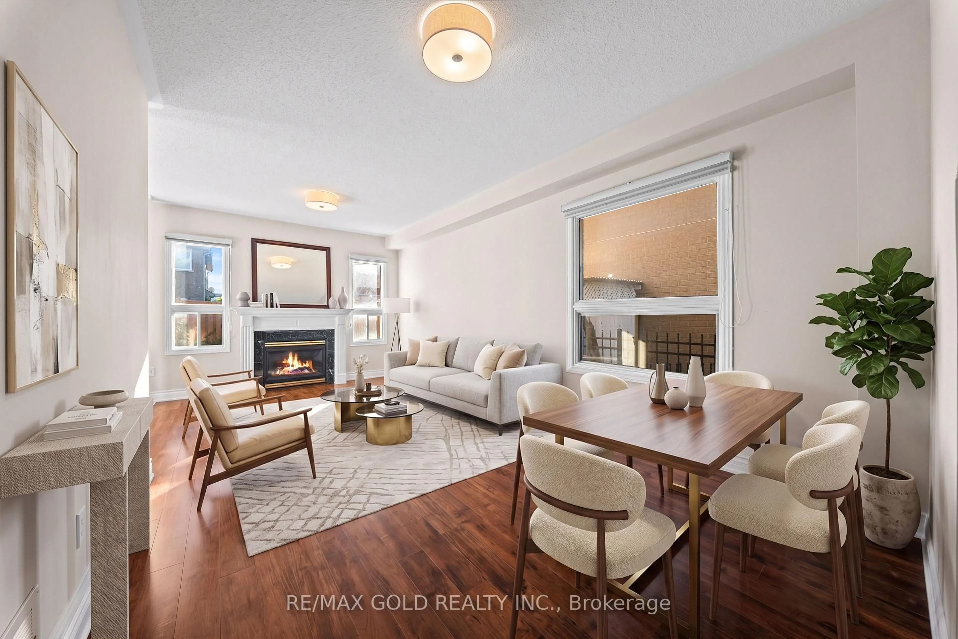 Living room with furniture, wood/laminate floor for 24 Alberta Terr, Brampton Ontario L6R 2H8