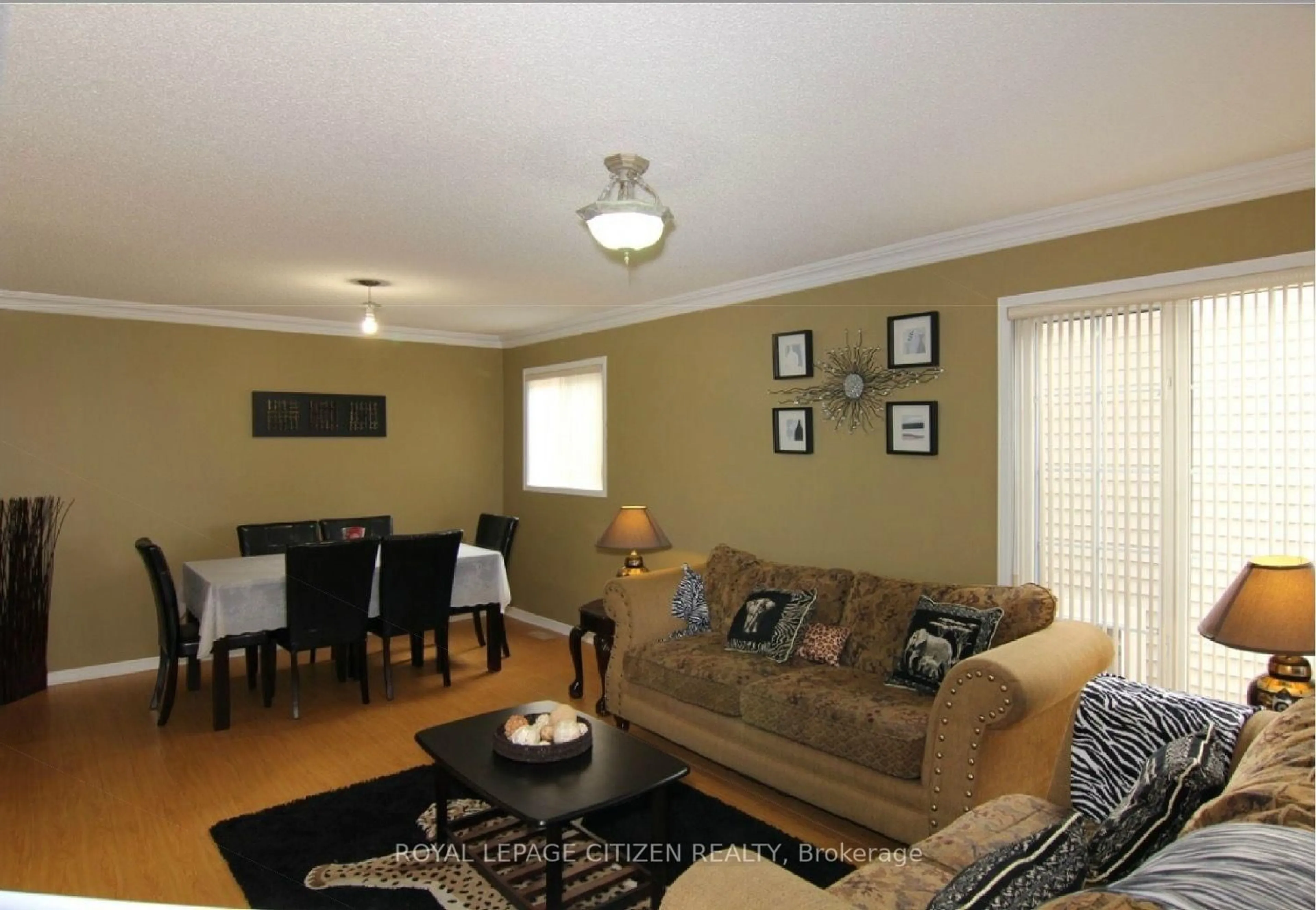 Living room with furniture, wood/laminate floor for 50 Fletchers Creek Blvd, Brampton Ontario L6X 4S3