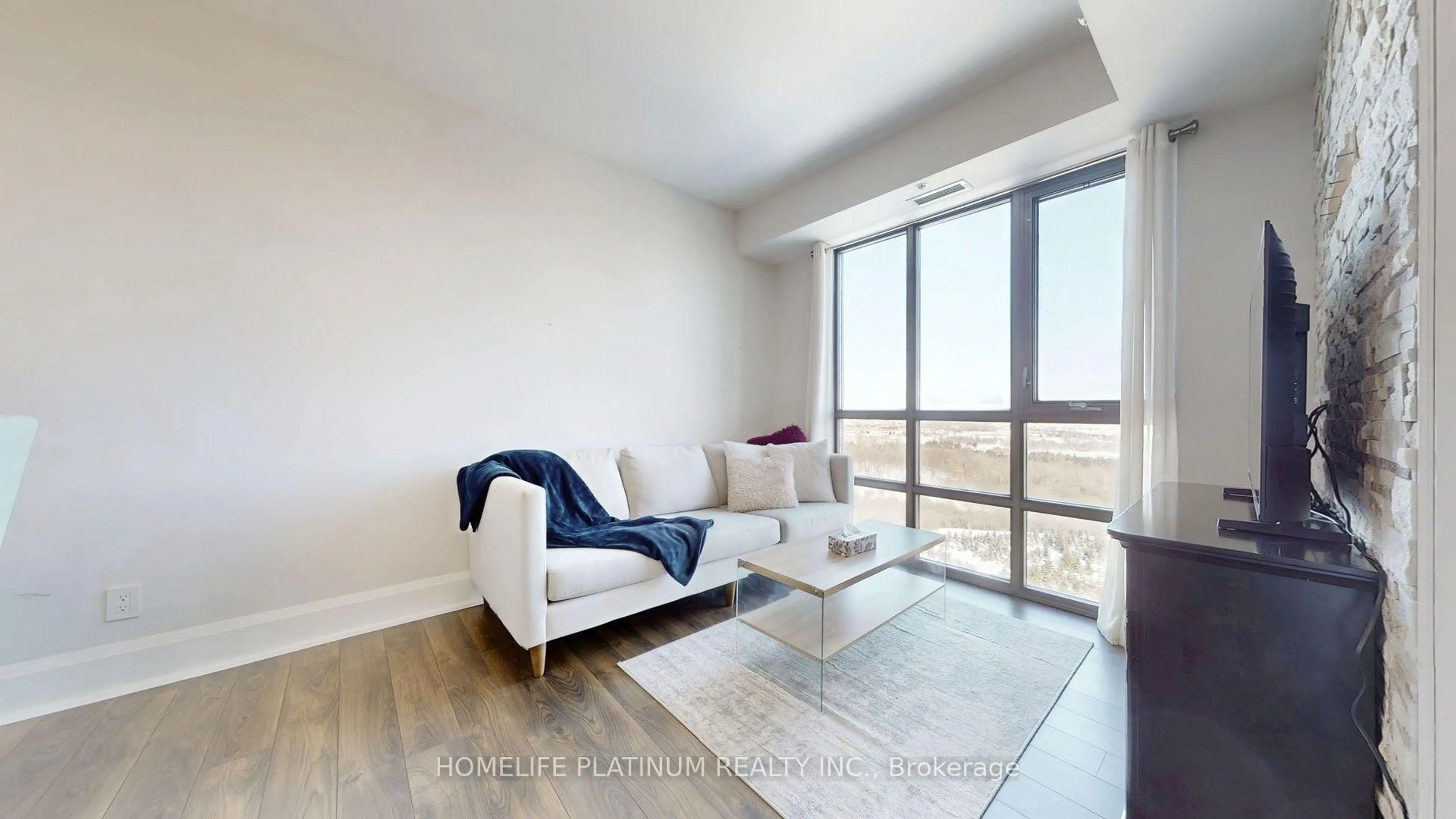 Living room with furniture, wood/laminate floor for 45 Yorkland Blvd #1106, Brampton Ontario L6P 4B4