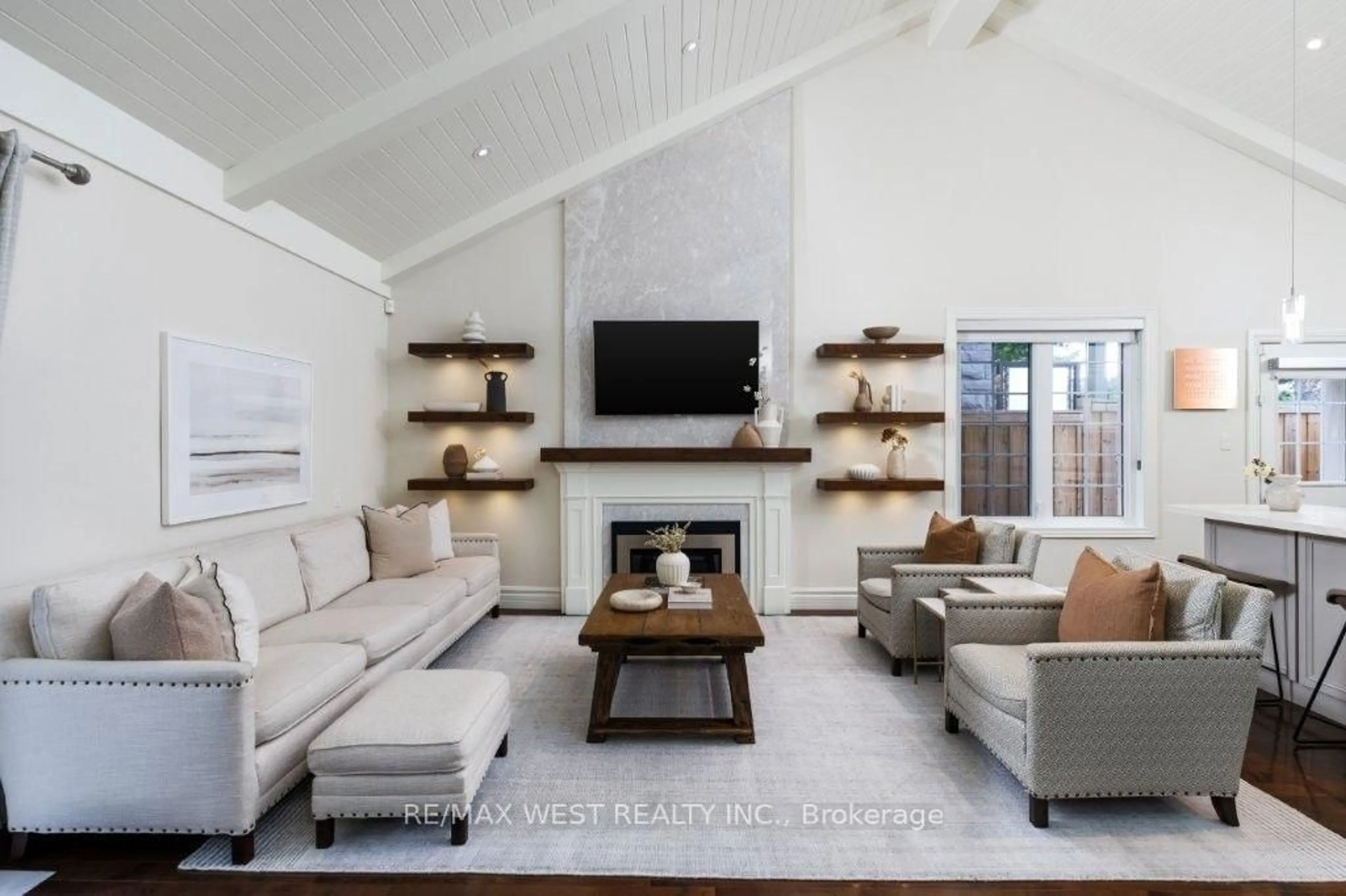 Living room with furniture, wood/laminate floor for 4653 Dundas St, Toronto Ontario M9A 1A4