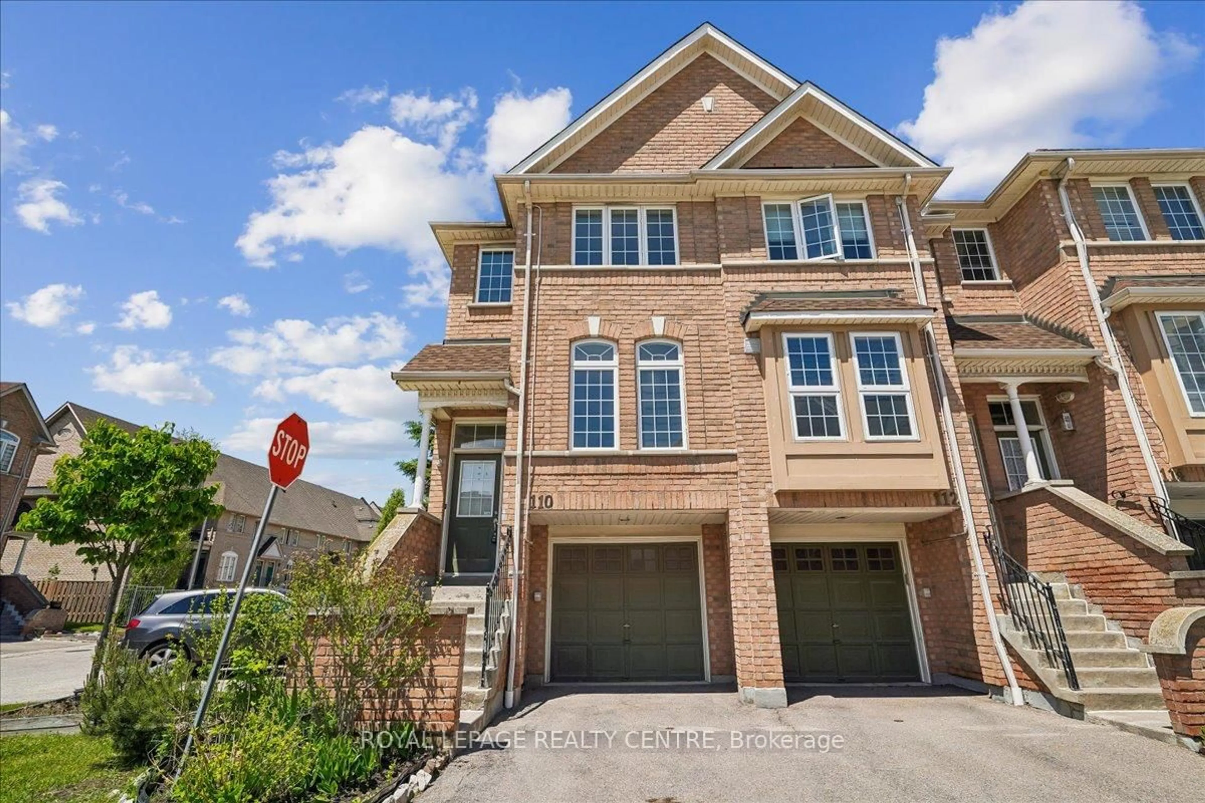 Home with brick exterior material, street for 50 Strathaven Dr #110, Mississauga Ontario L5R 4E7