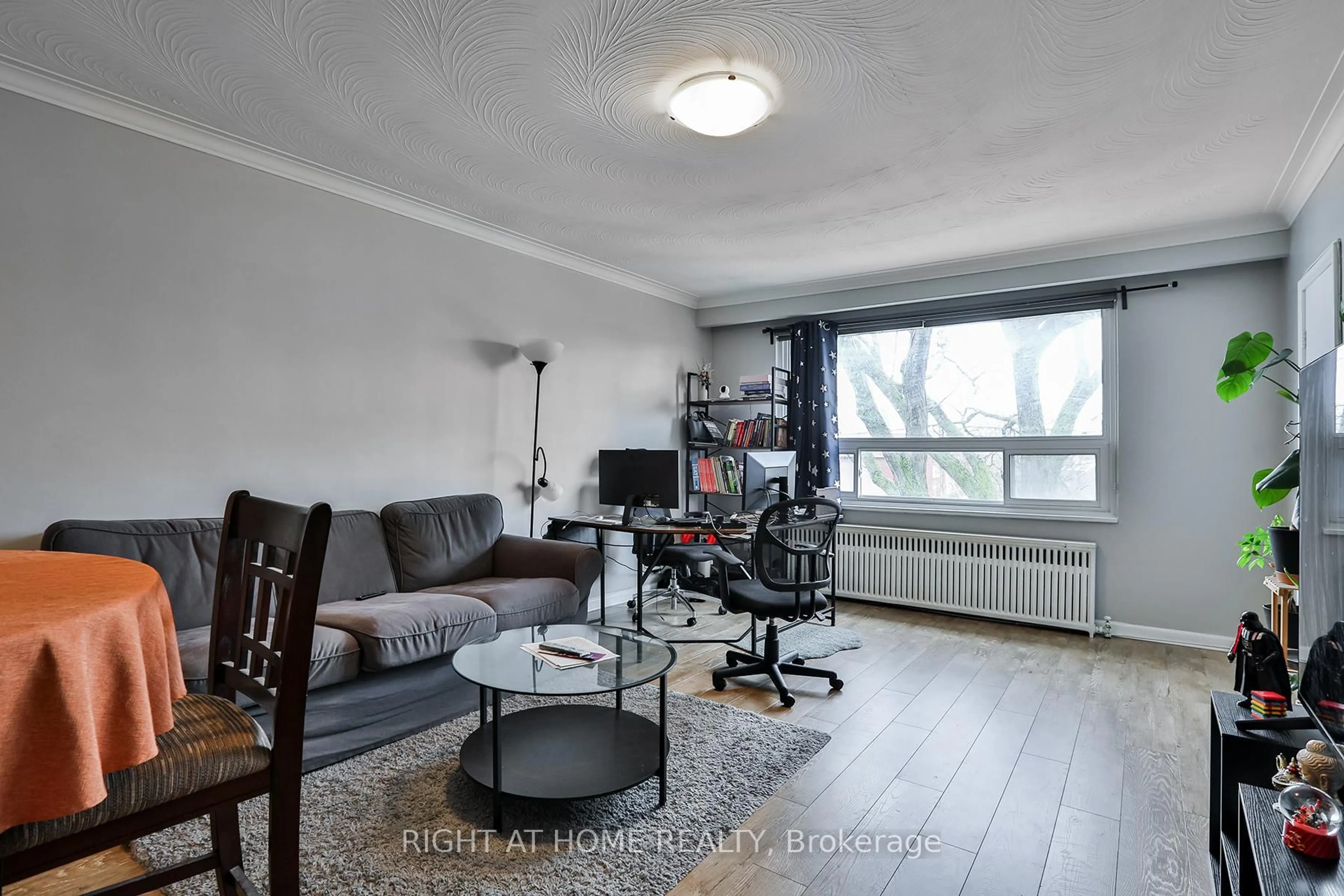 Living room with furniture, wood/laminate floor for 35 Fifteenth St, Toronto Ontario M8V 3J3
